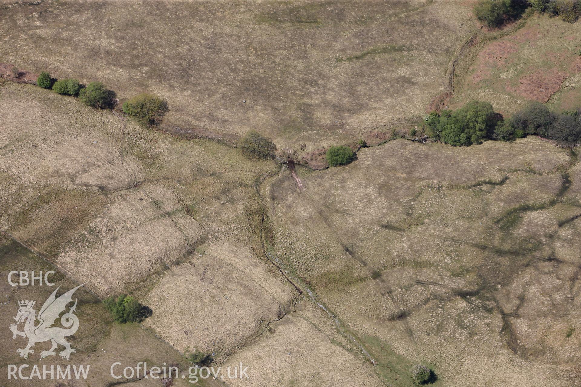 RCAHMW colour oblique photograph of Llwyn Wennol, burnt mound, at edge of frame. Taken by Toby Driver on 22/05/2012.