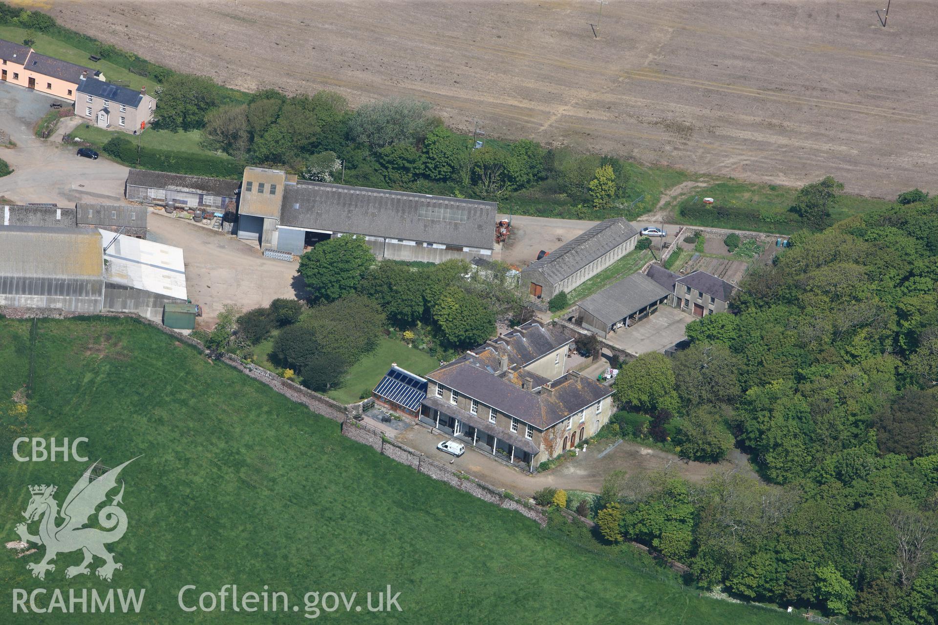 RCAHMW colour oblique photograph of General view of Trewarren House, looking north west. Taken by Toby Driver on 24/05/2012.