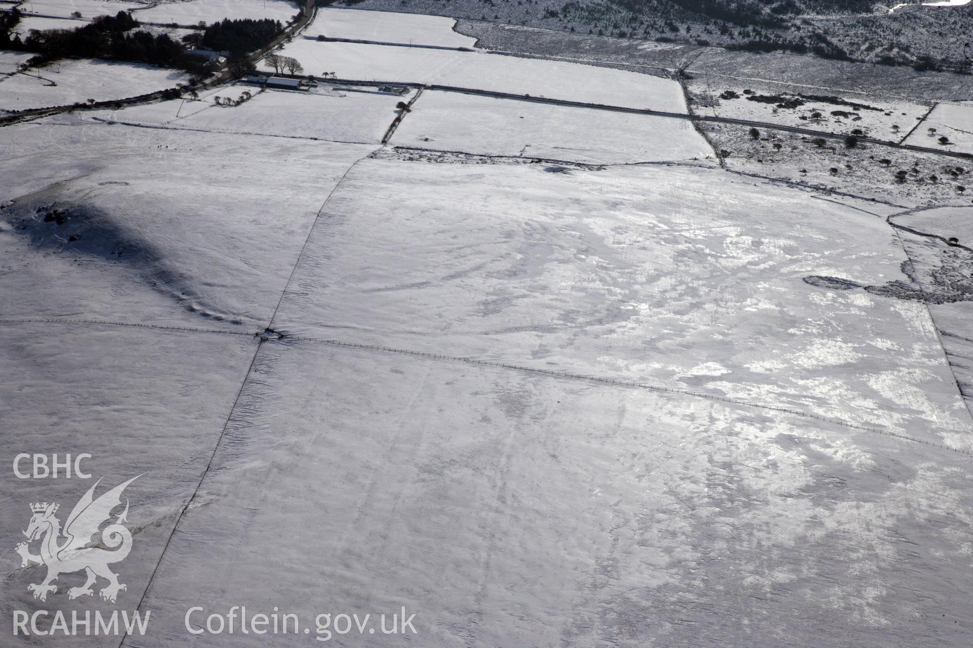 RCAHMW colour oblique photograph of Banc Du Neolithic Enclosure. Taken by Toby Driver on 02/02/2012.