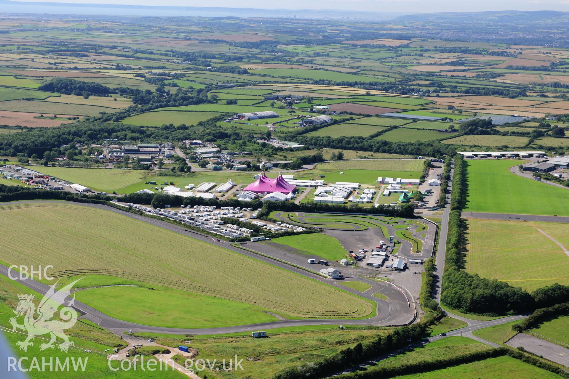 RCAHMW colour oblique photograph of Llandow Airfield, site of the 2012 National Eisteddfod of Wales. Taken by Toby Driver on 24/07/2012.