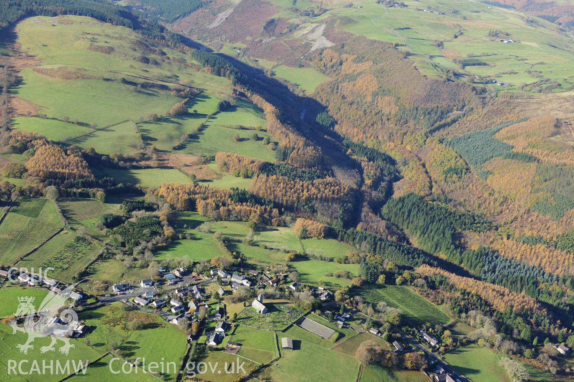 RCAHMW colour oblique photograph of Ysbyty Ystwyth village, landscape looking west with autumn colours. Taken by Toby Driver on 05/11/2012.