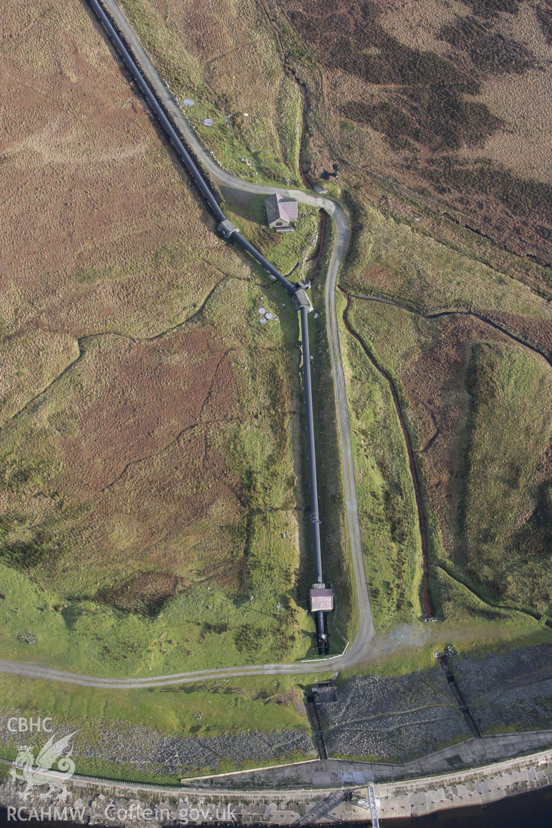 RCAHMW colour oblique photograph of Llyn Cowlyd, pipeline issuing from dam. Taken by Toby Driver on 13/01/2012.