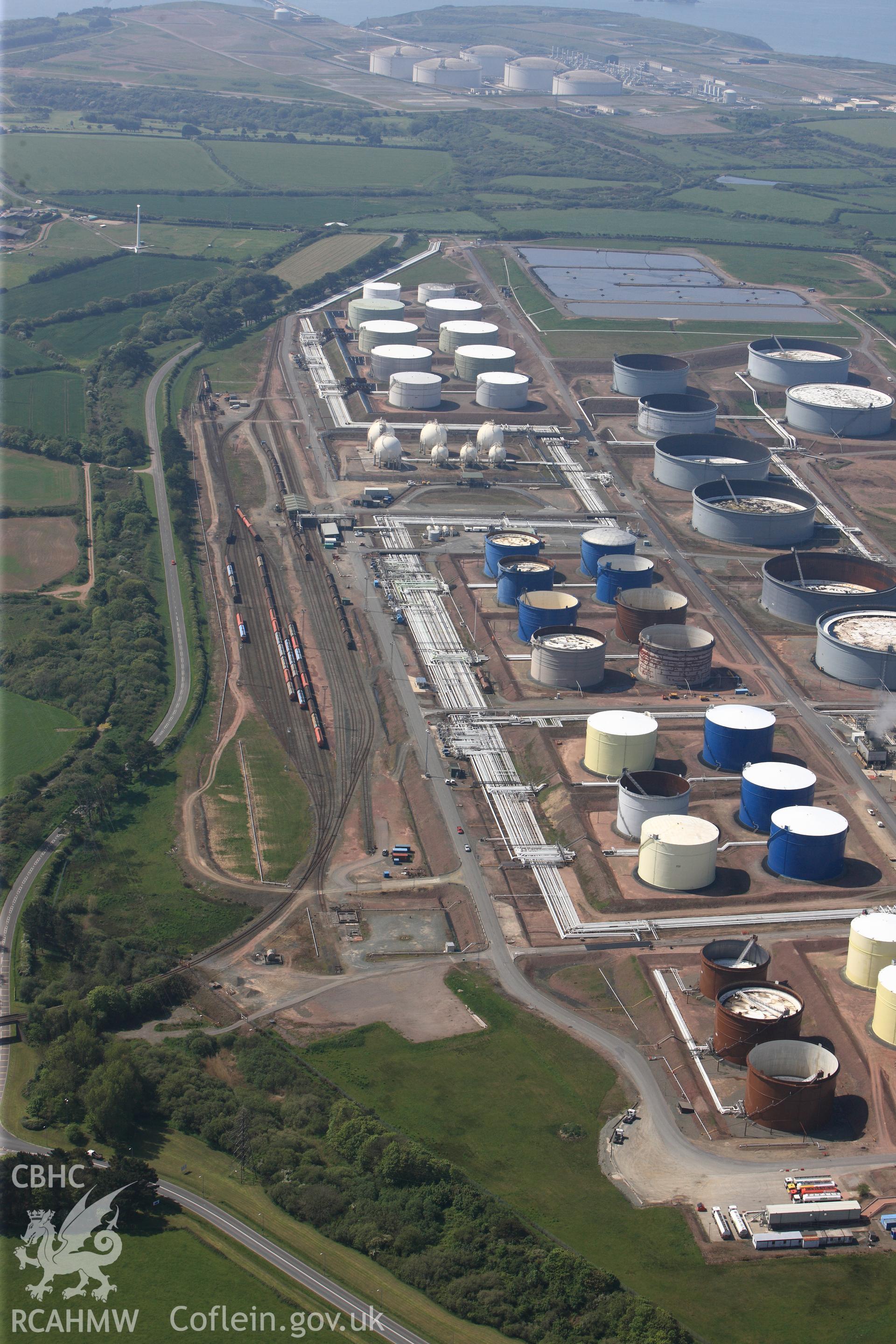RCAHMW colour oblique photograph of General view of Amoco oil refinery, looking south west. Taken by Toby Driver on 24/05/2012.