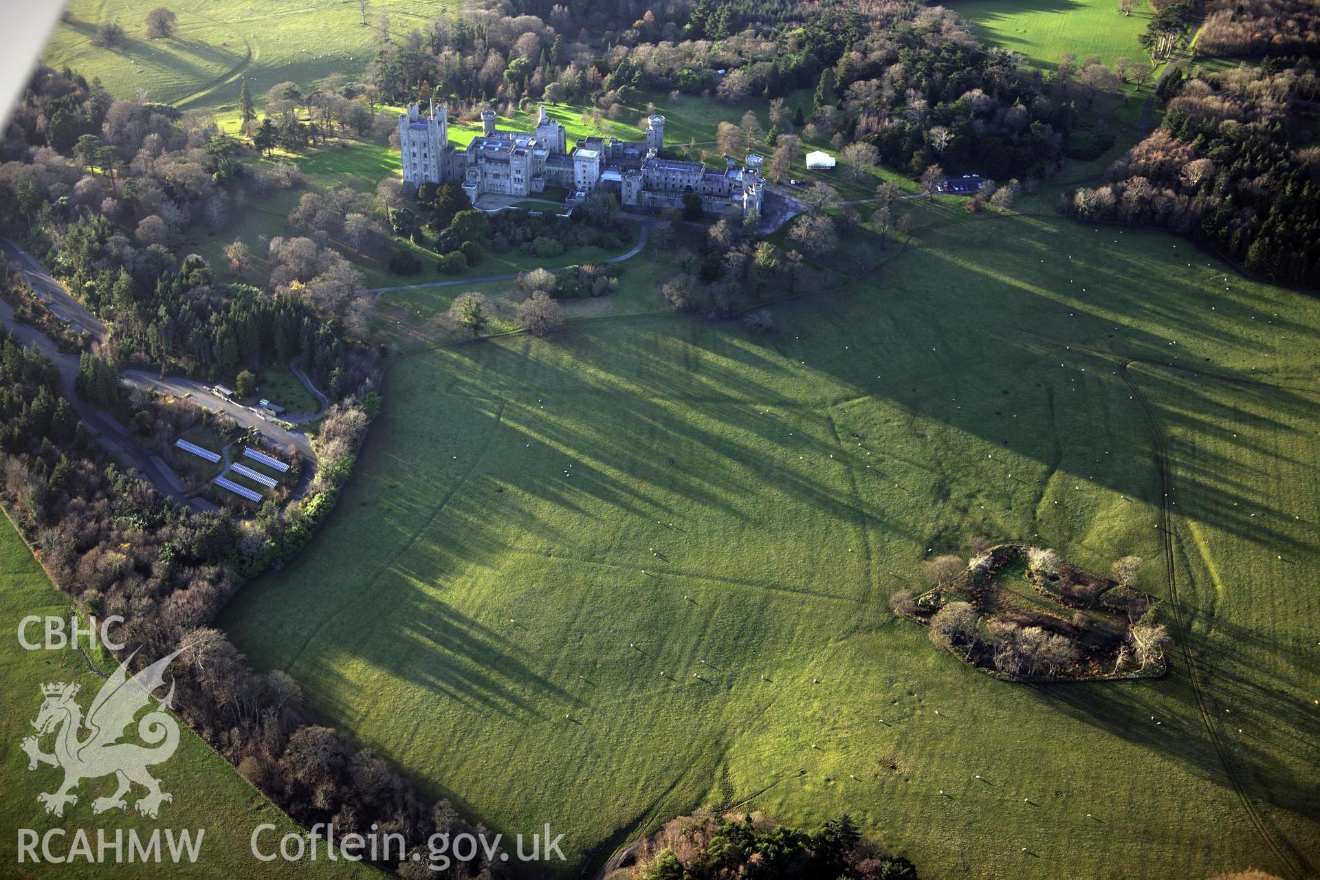RCAHMW colour oblique photograph of Penrhyn Park earthworks, ridge and furrow earthworks to east of Castle. Taken by Toby Driver on 10/12/2012.