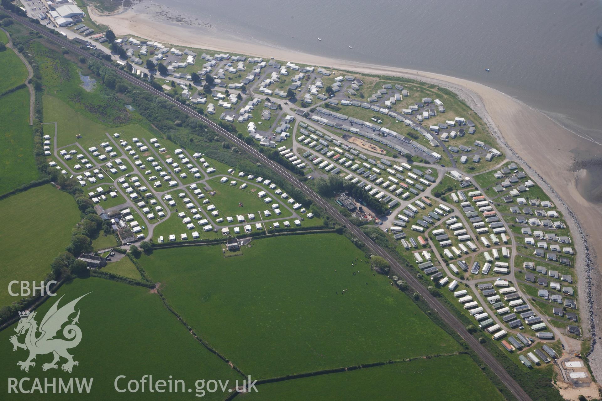 RCAHMW colour oblique photograph of General view Carmarthen Bay Holiday Centre, south east of of St Ishmaels deserted medieval village, looking south east. Taken by Toby Driver on 24/05/2012.