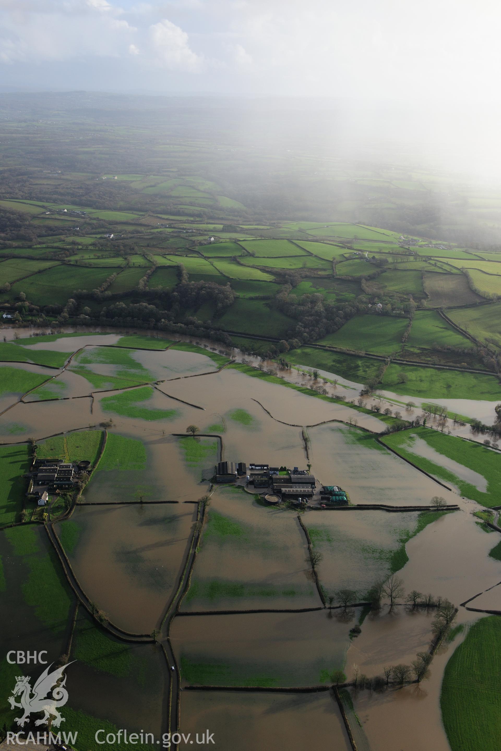 RCAHMW colour oblique photograph of Glantowy Fawr farm, with flooding, view from north-west. Taken by Toby Driver on 23/11/2012.