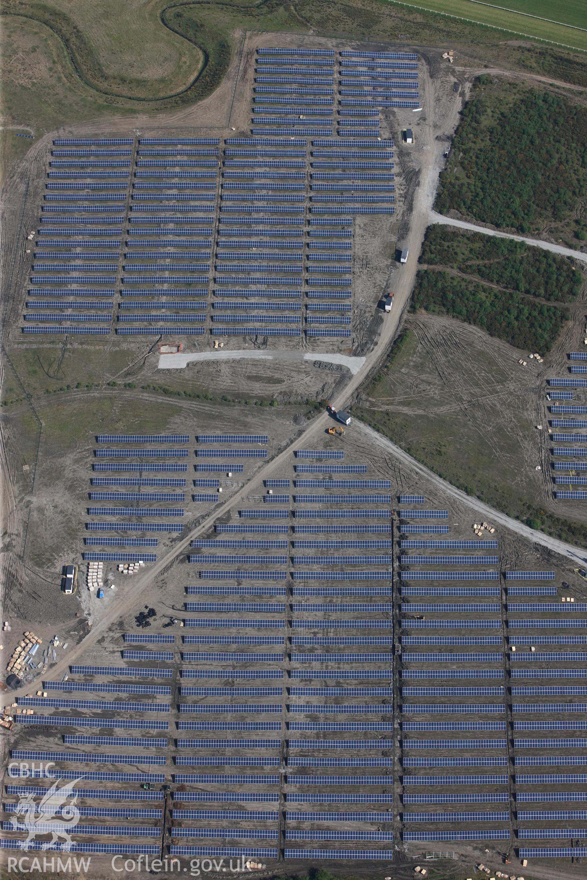 RCAHMW colour oblique photograph of Close view of solar farm south of Ffos Las racecourse, looking north. Taken by Toby Driver on 24/05/2012.