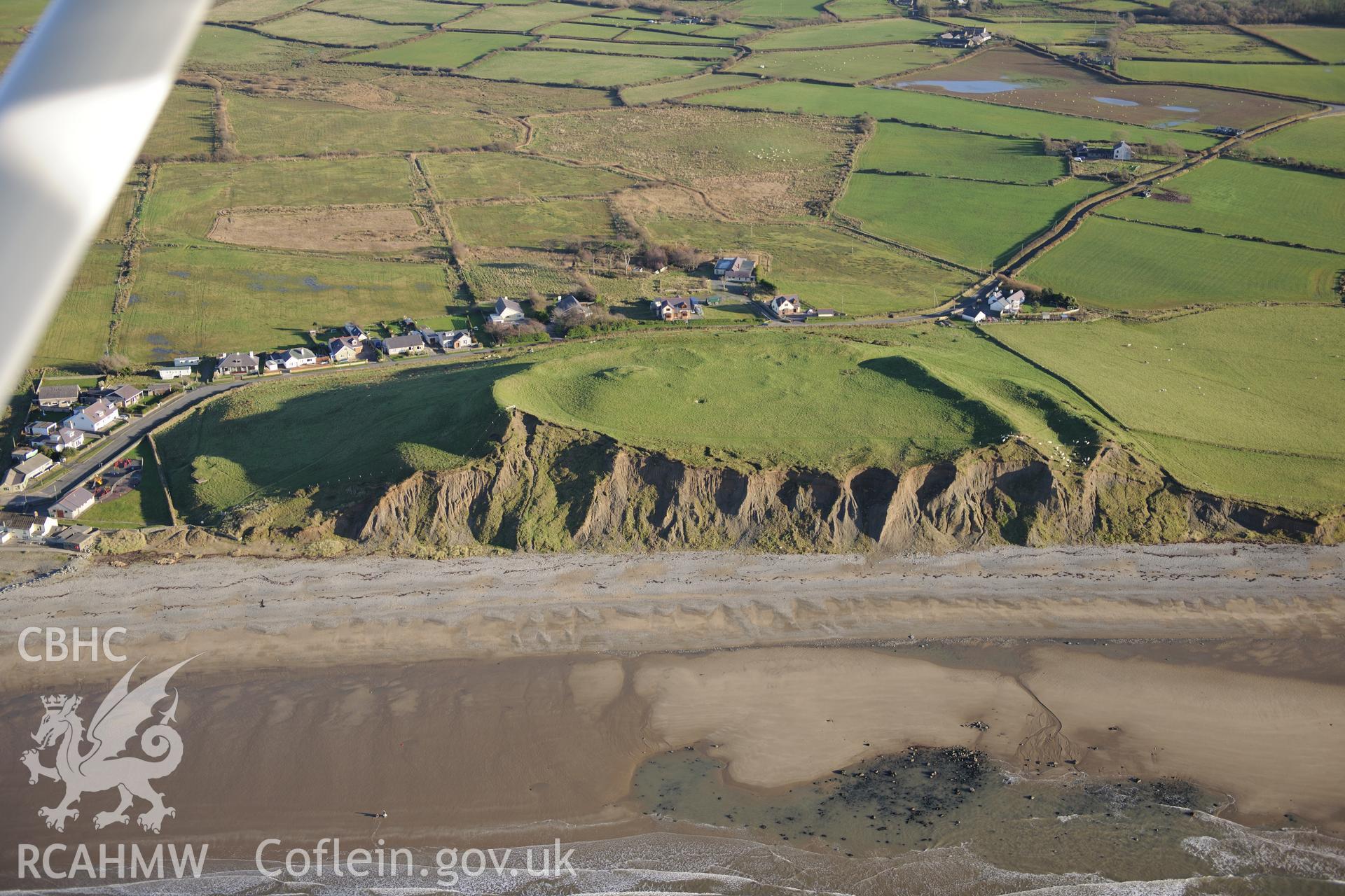 RCAHMW colour oblique photograph of Dinas Dinlle Hillfort, Llandwrog, with eroding cliff face. Taken by Toby Driver on 10/12/2012.