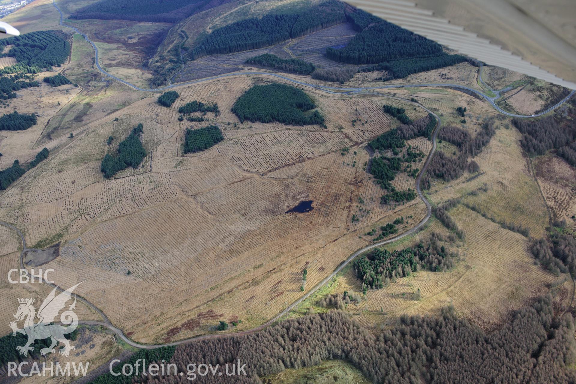 RCAHMW colour oblique photograph of Castell y Mawn forestry, north-east of Maerdy. Taken by Toby Driver on 28/11/2012.
