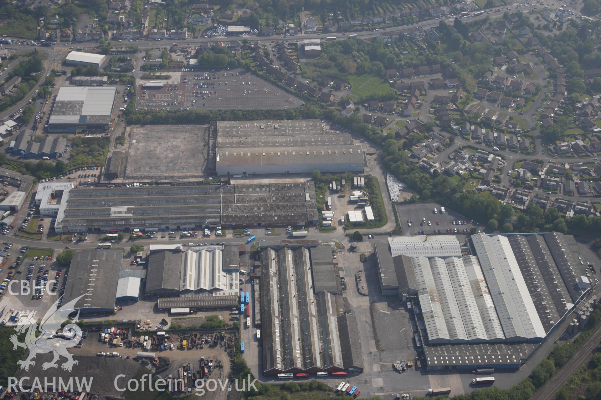 RCAHMW colour oblique photograph of General view of Swansea West Industrial Estate including former War Materials factory, looking north east. Taken by Toby Driver on 24/05/2012.