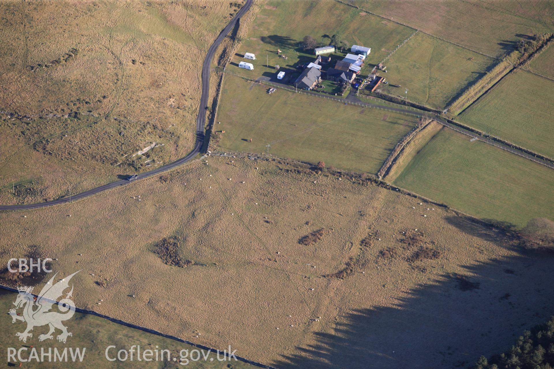 RCAHMW colour oblique photograph of Tanforhesgan earthwork enclosure. Taken by Toby Driver on 10/12/2012.