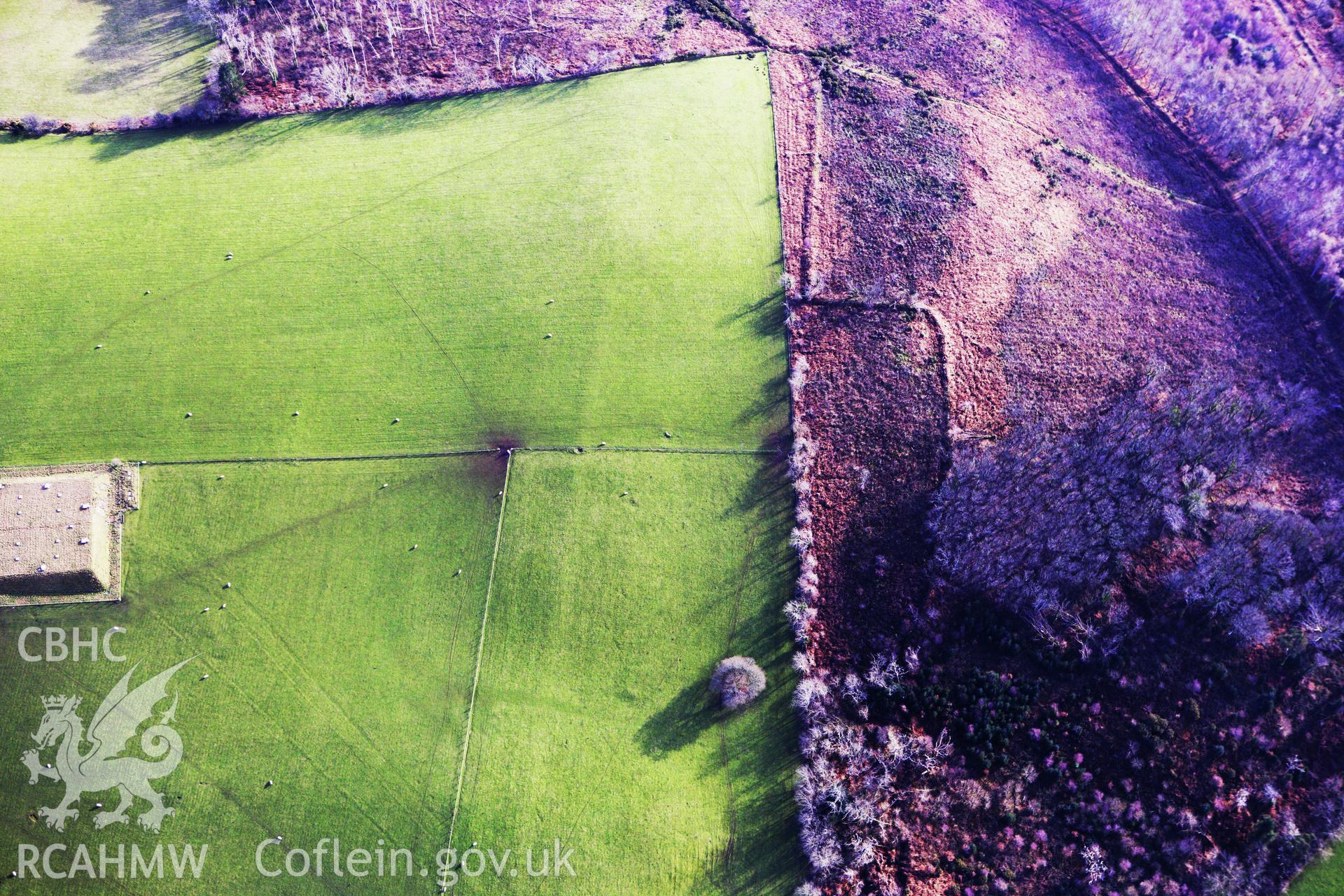 RCAHMW colour oblique photograph of Hen Gaer, denuded enclosure west of fort. Taken by Toby Driver on 07/02/2012.