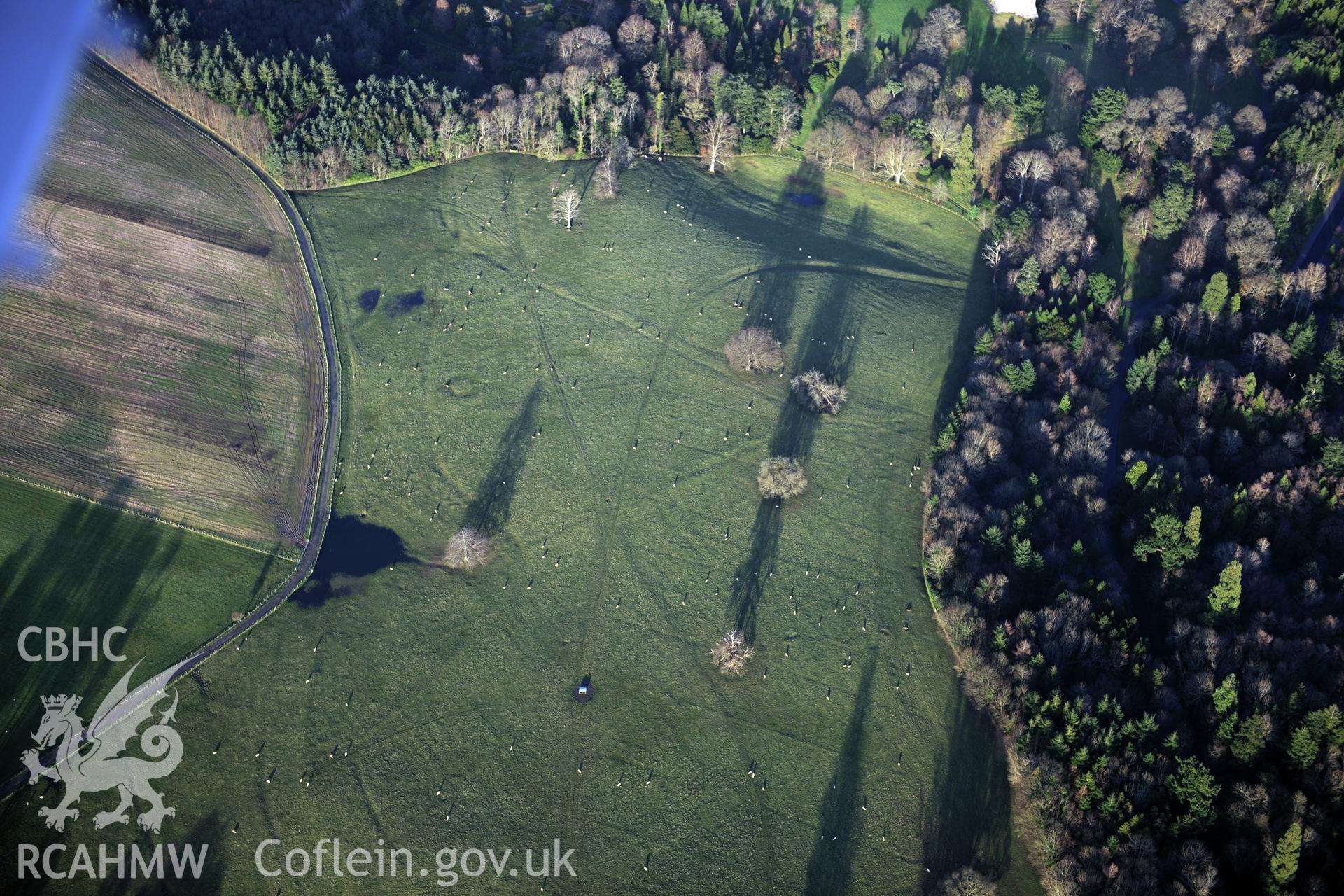 RCAHMW colour oblique photograph of Penrhyn Park earthworks. Taken by Toby Driver on 10/12/2012.