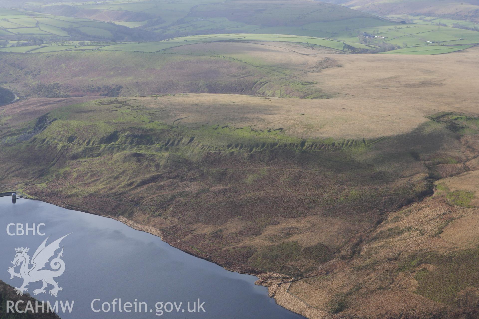 RCAHMW colour oblique photograph of Old quarry workings on the lower slopes of Banc Darren-fawr, above the Upper Lliw reservoir. Taken by Toby Driver on 27/01/2012.