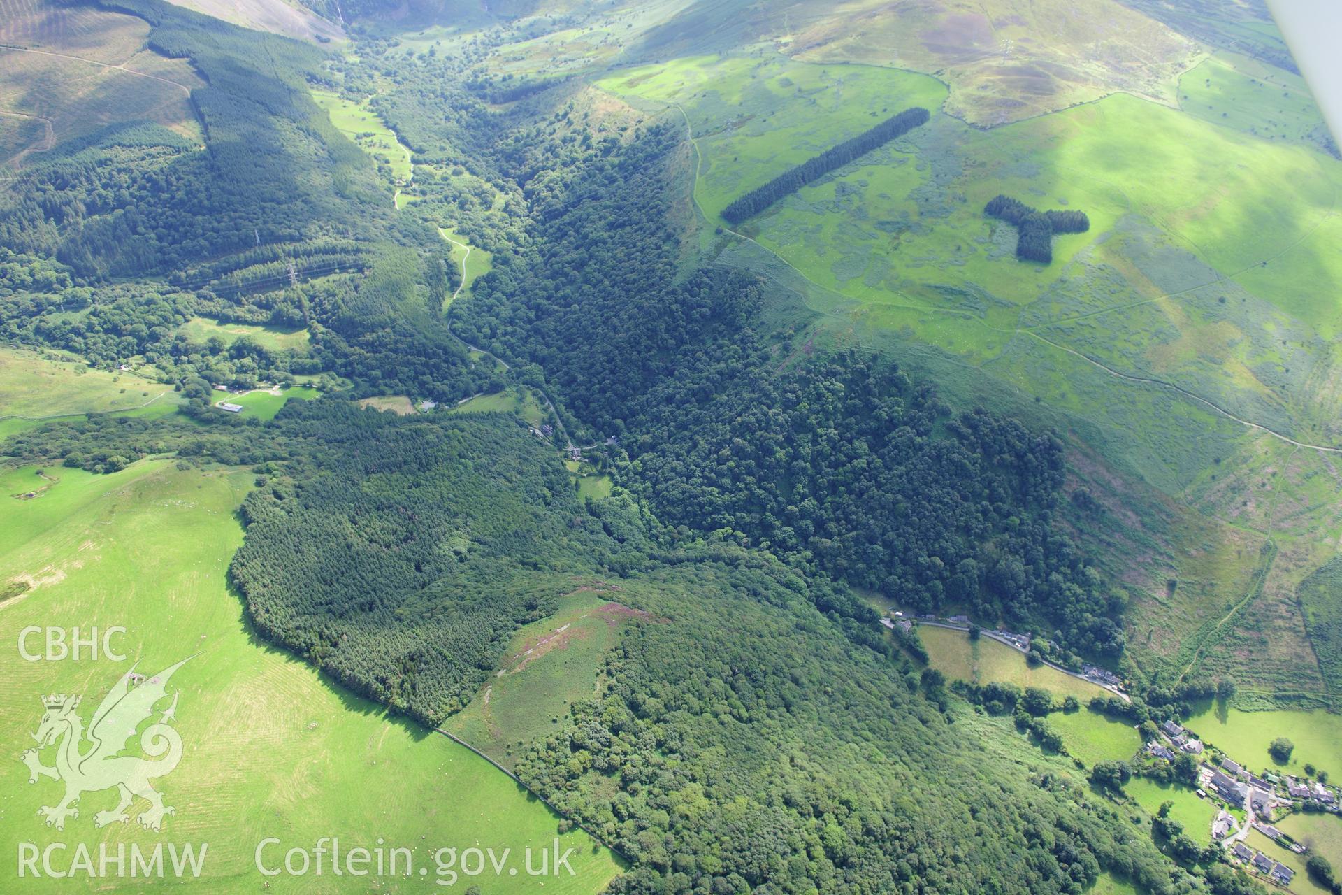 RCAHMW colour oblique photograph of Maes-y-Gaer hill fort, landscape view. Taken by Toby Driver on 10/08/2012.