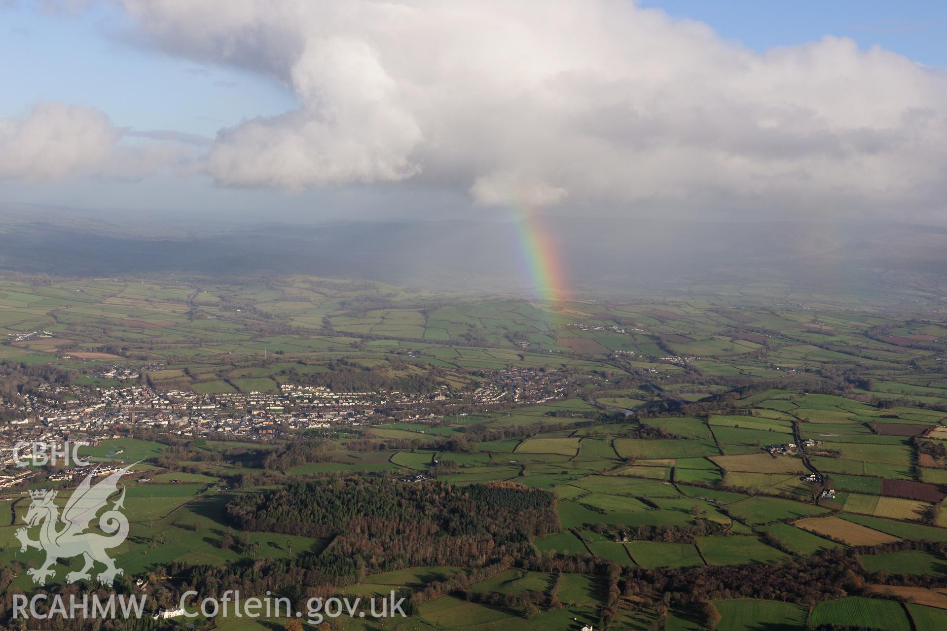 RCAHMW colour oblique photograph of Brecon, distant townscape from south-west over Held Wood, with rainbow. Used in: Musson & Driver 2015, Above Brecknock, page 126. Taken by Toby Driver on 23/11/2012.