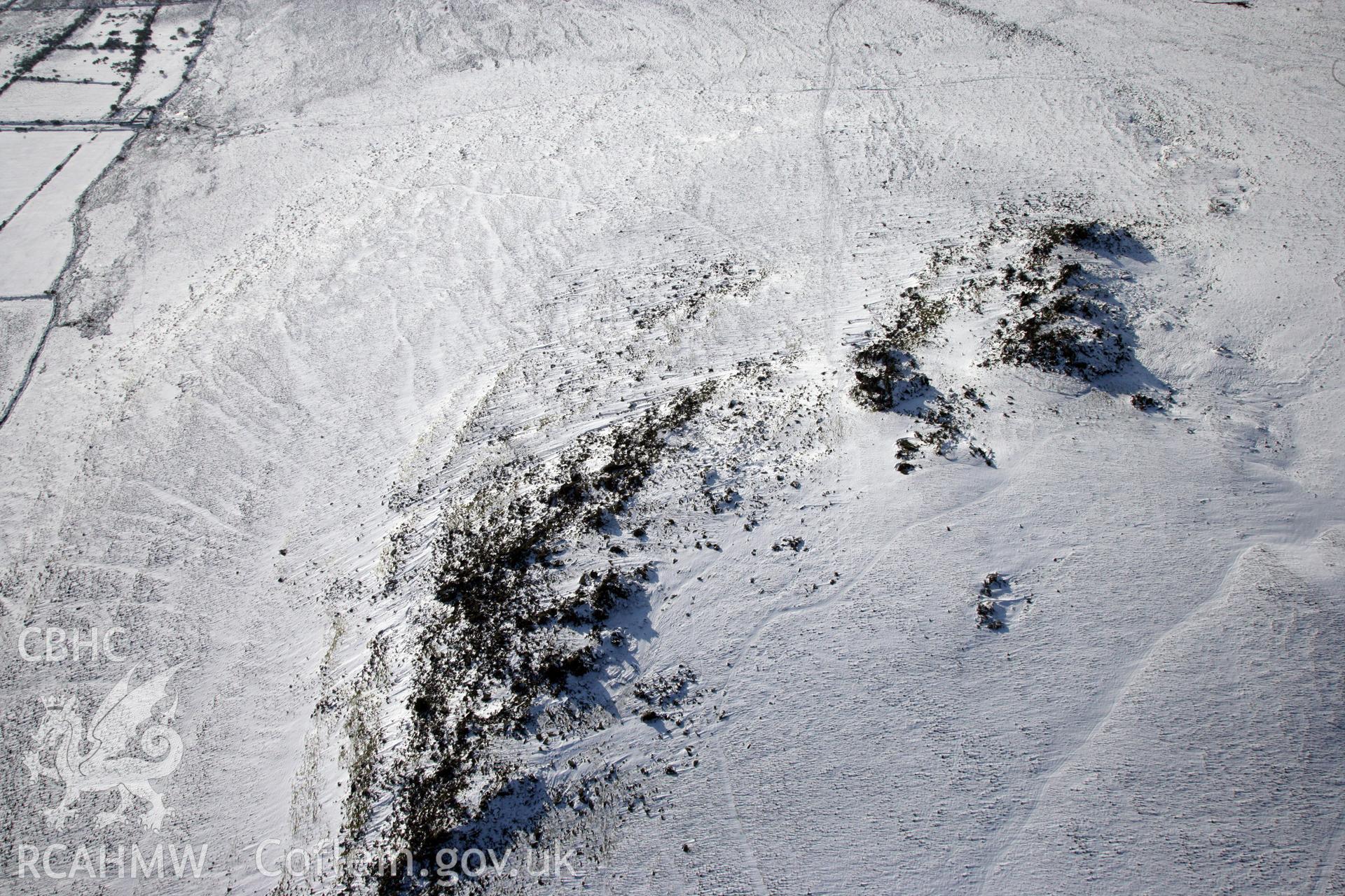 RCAHMW colour oblique photograph of Carn Meini Bluestone Outcrops of Spotted Dolerite. Taken by Toby Driver on 02/02/2012.