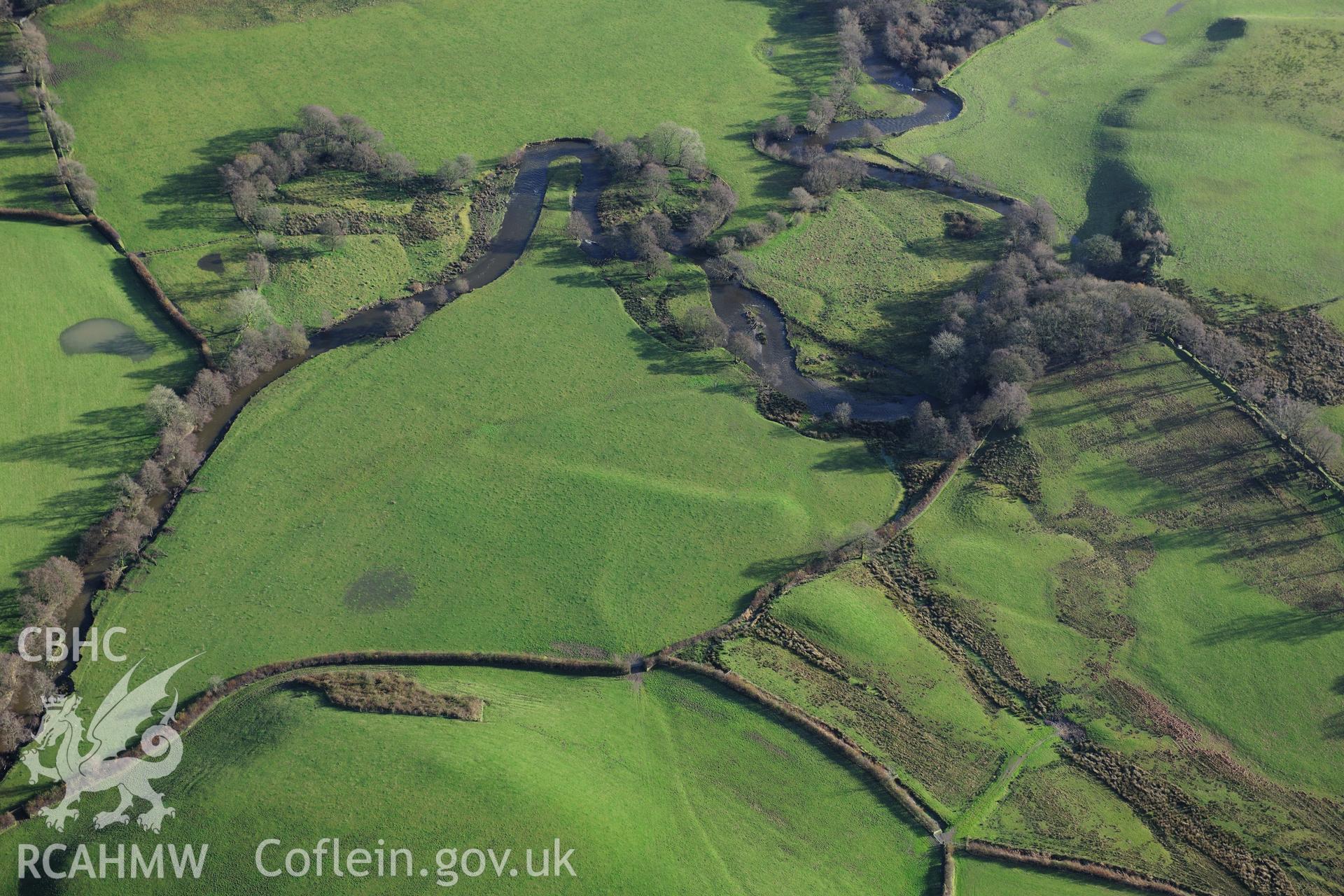 RCAHMW colour oblique photograph of Caerau Roman fort, riverside earthworks to south-east. Taken by Toby Driver on 23/11/2012.