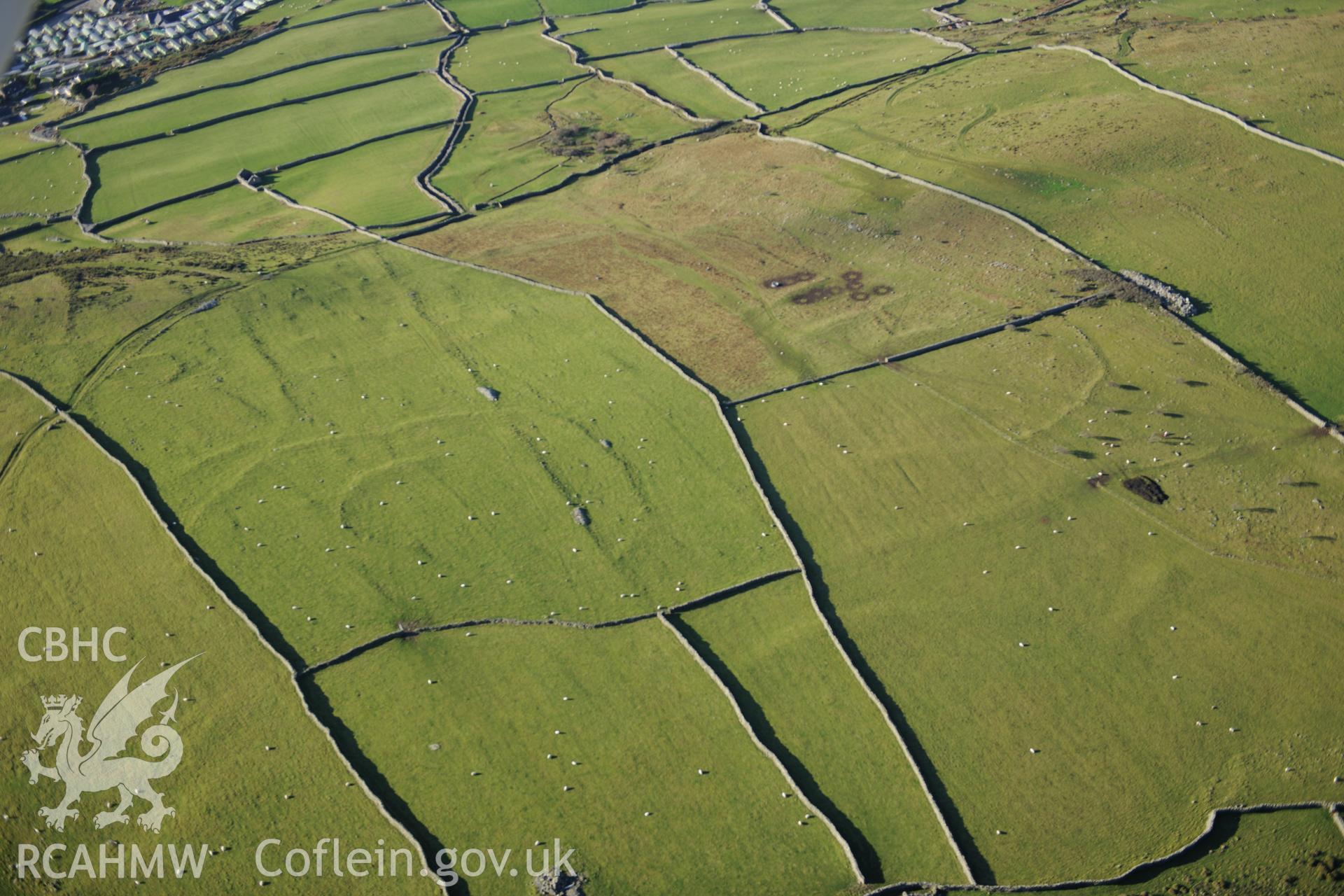 RCAHMW colour oblique photograph of Hendre Coed Uchaf concentric enclosures. Taken by Toby Driver on 10/12/2012.