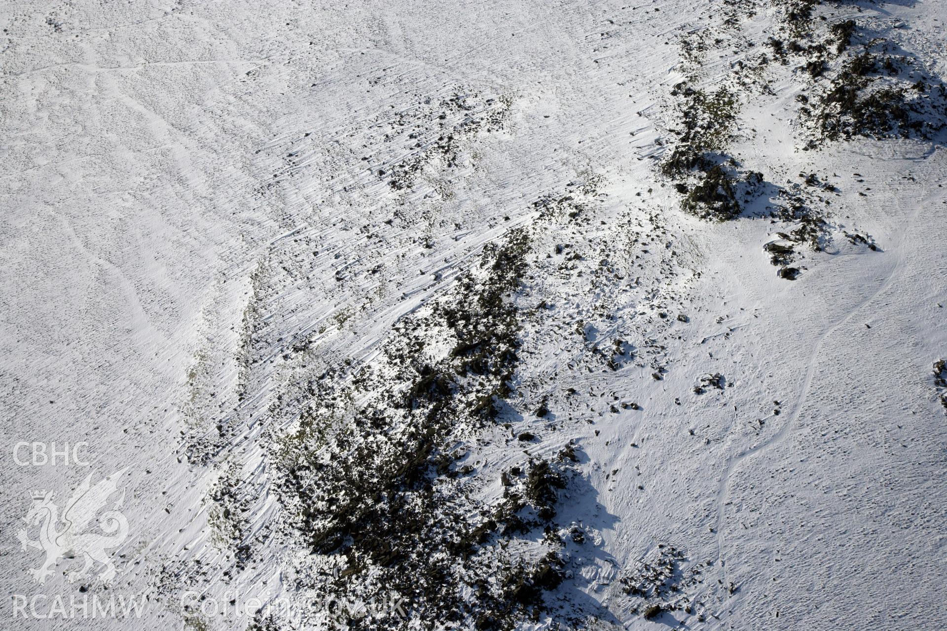 RCAHMW colour oblique photograph of Carn Meini Bluestone Outcrops of Spotted Dolerite. Taken by Toby Driver on 02/02/2012.