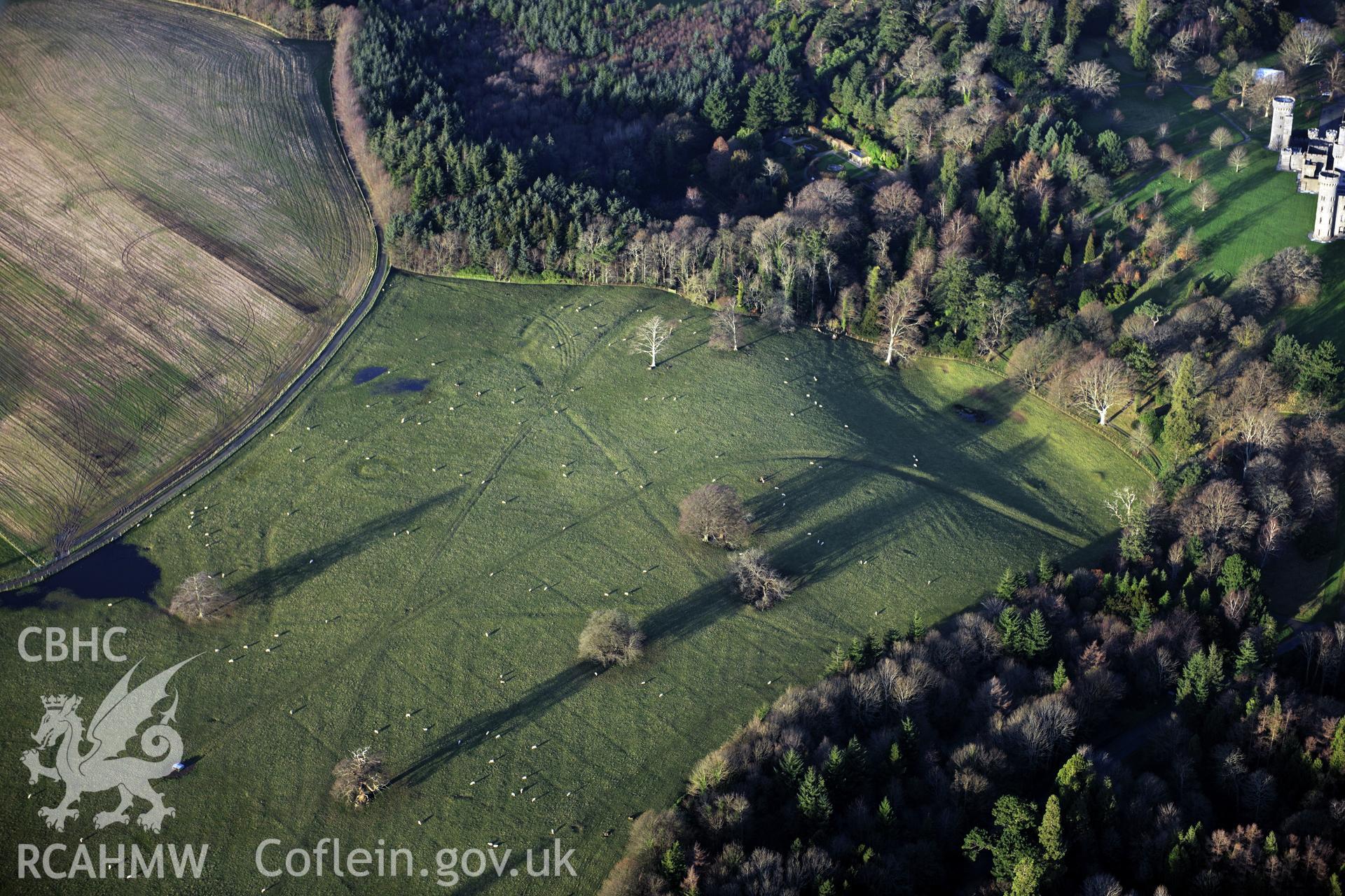 RCAHMW colour oblique photograph of Penrhyn Park earthworks. Taken by Toby Driver on 10/12/2012.