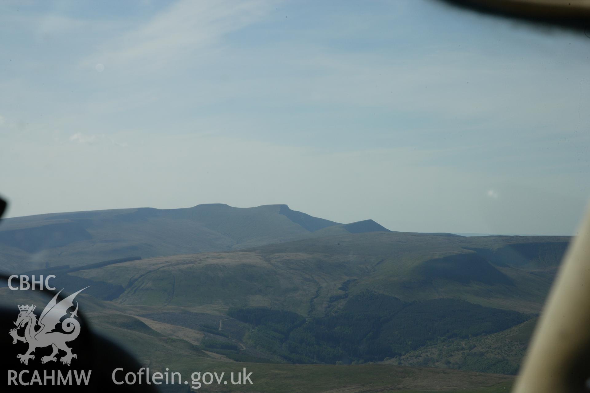 RCAHMW colour oblique photograph of Brecon Beacons (distant view), photographed from the south-east in transit over Pontsticill Reservoir (SO 0513). Taken by Toby Driver on 22/05/2012.
