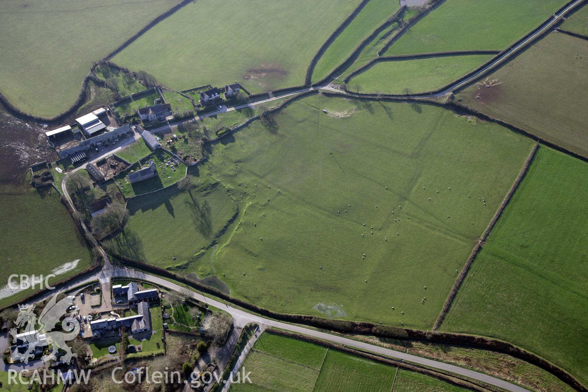 RCAHMW colour oblique photograph of Llanddewi Earthworks. Taken by Toby Driver on 02/02/2012.