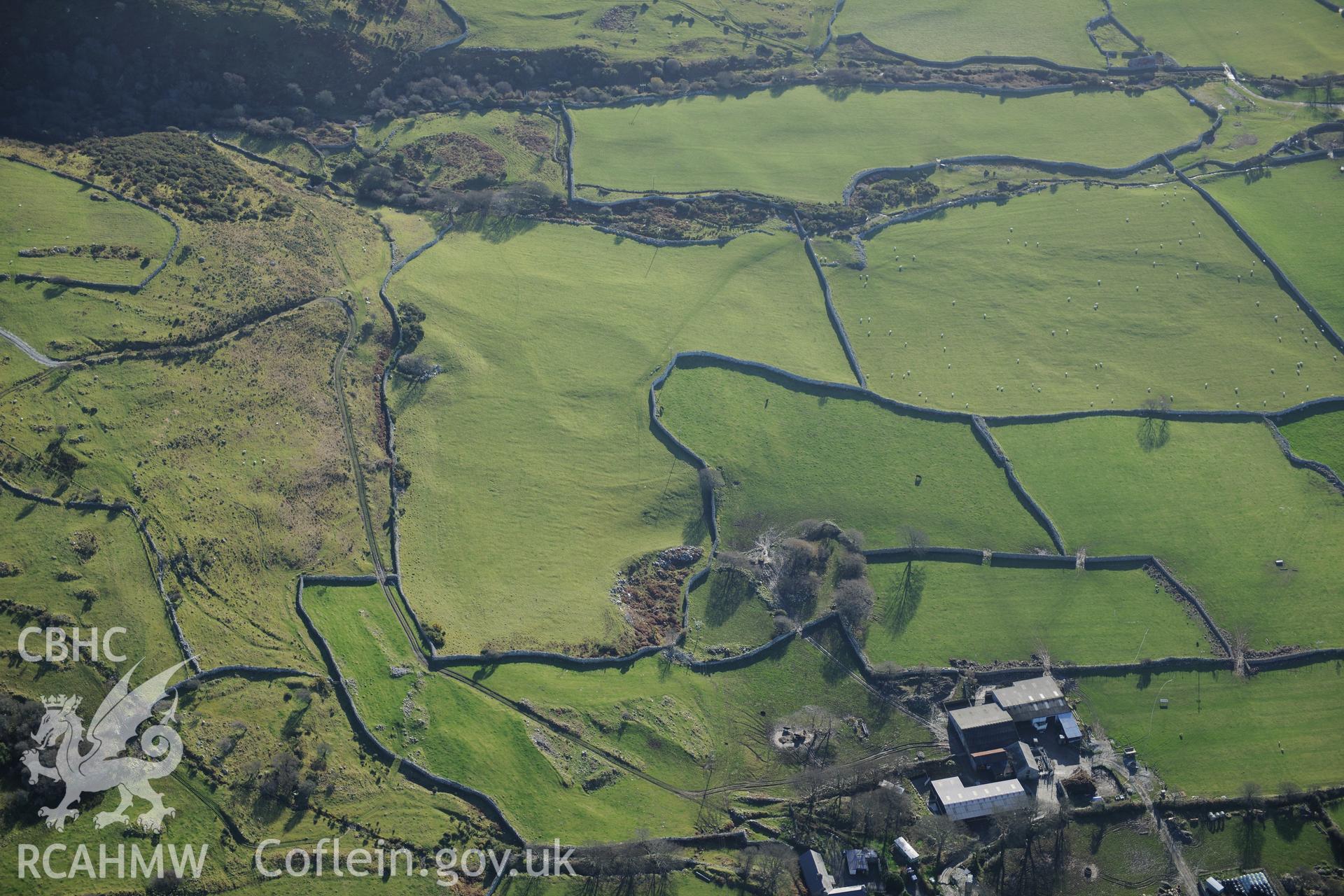 RCAHMW colour oblique photograph of Cae Gwyn, homestead, with field system earthworks beyond. Taken by Toby Driver on 10/12/2012.