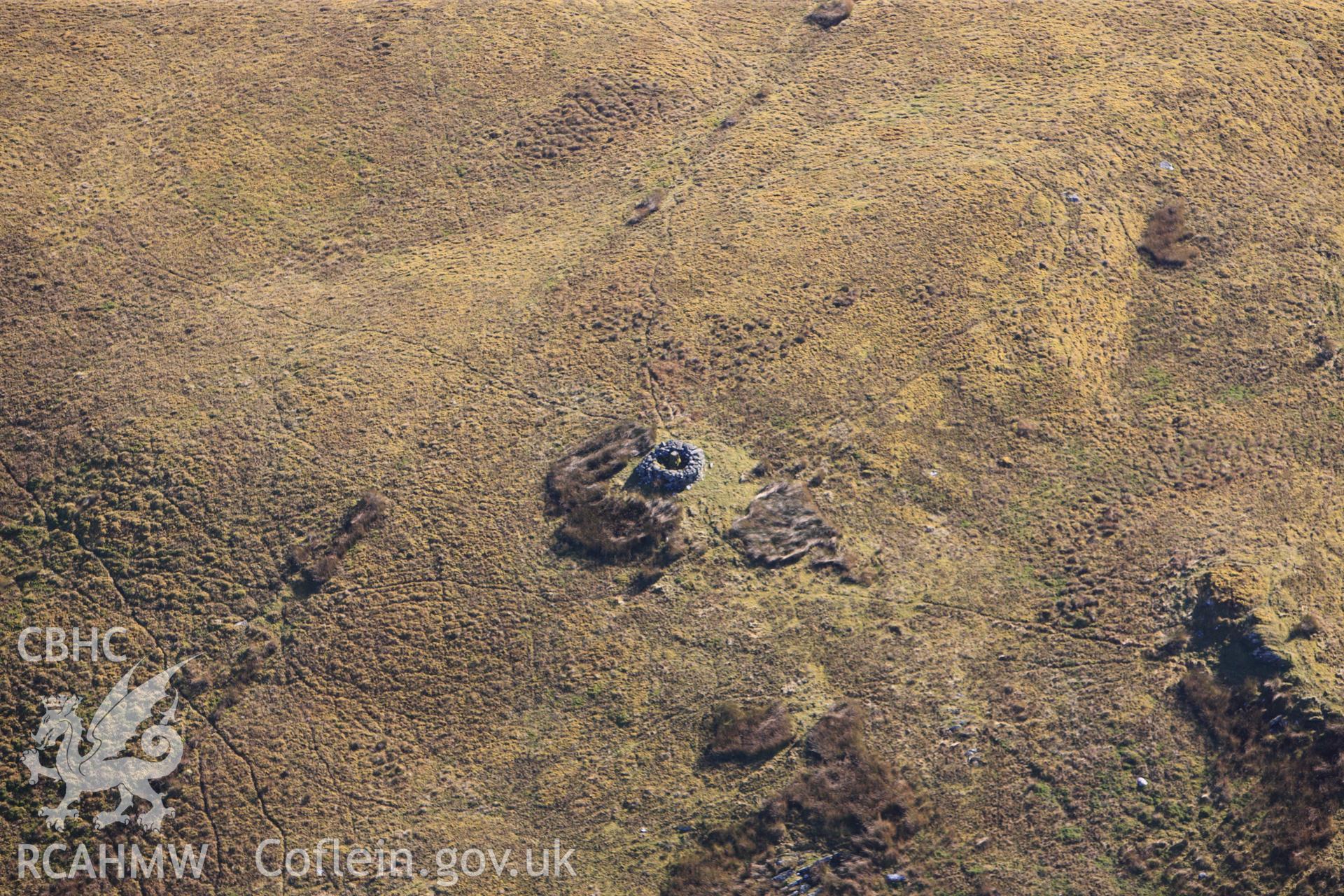 RCAHMW colour oblique photograph of Crug, cairn, in winter landscape. Taken by Toby Driver on 05/11/2012.