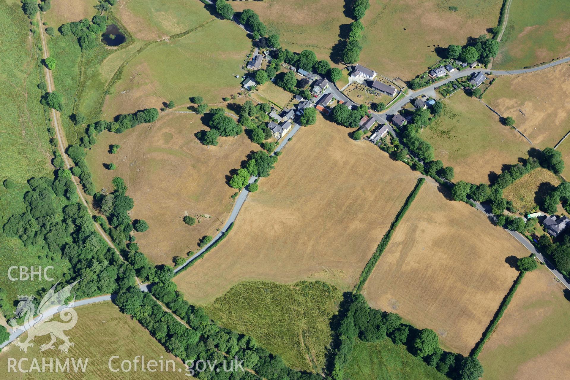 Royal Commission aerial photography of Ystrad Meurig castle and village with extensive parching, taken on 19th July 2018 during the 2018 drought.