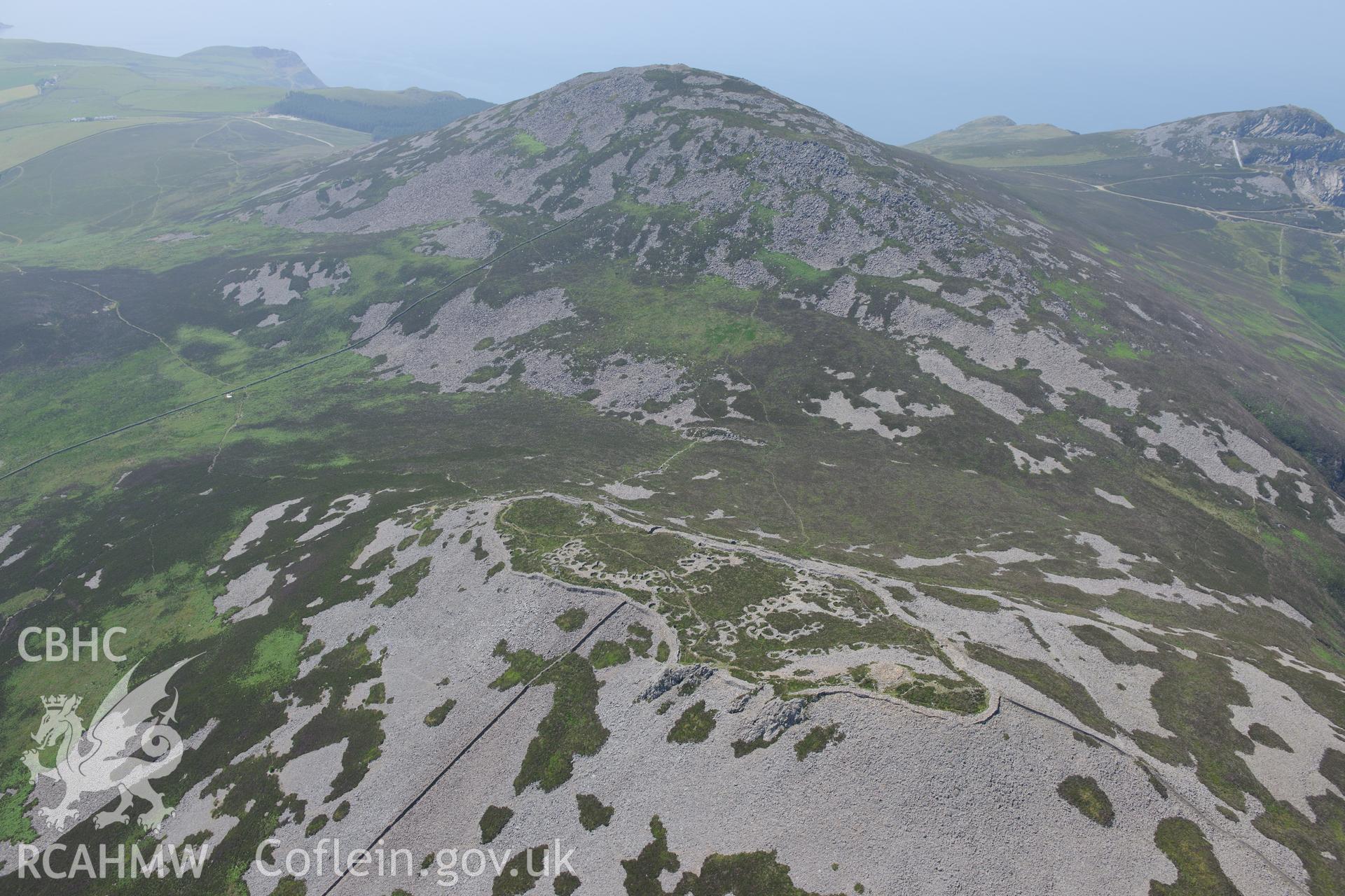 Tre'r Ceiri hillfort, on the Lleyn Peninsula. Oblique aerial photograph taken during the Royal Commission?s programme of archaeological aerial reconnaissance by Toby Driver on 12th July 2013.