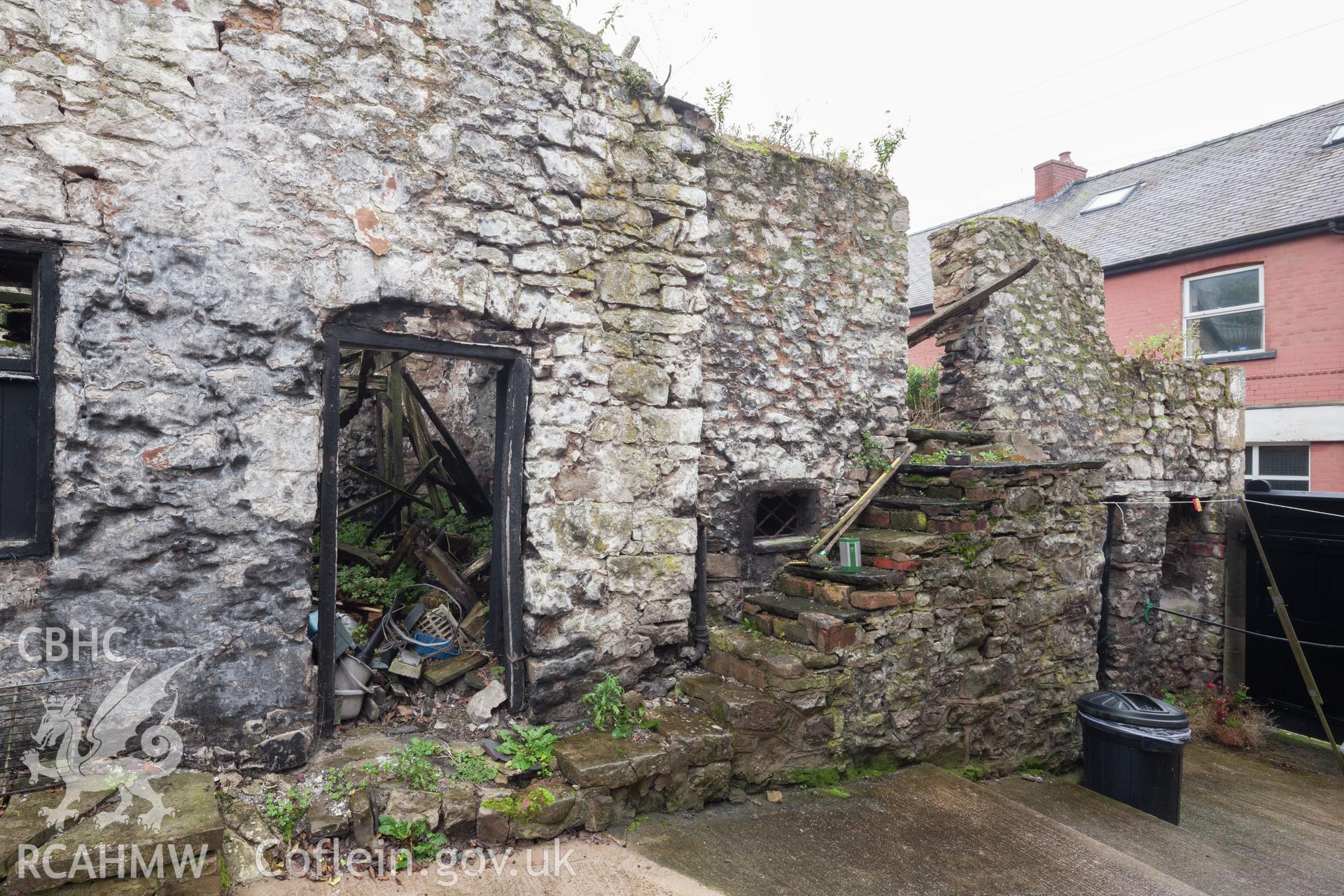 View from the northeast, access steps to upper floor