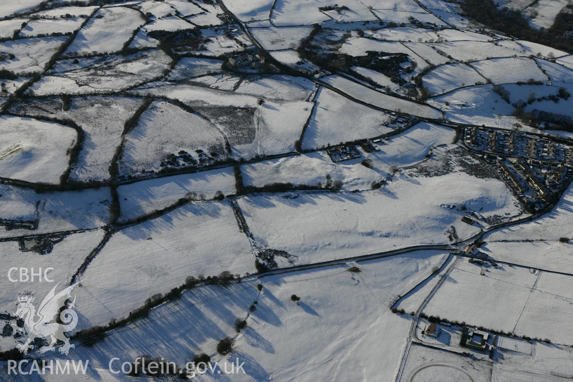 RCAHMW colour oblique photograph of Pen-y-Coedcae Roman marching camp. Taken by Toby Driver on 08/12/2010.