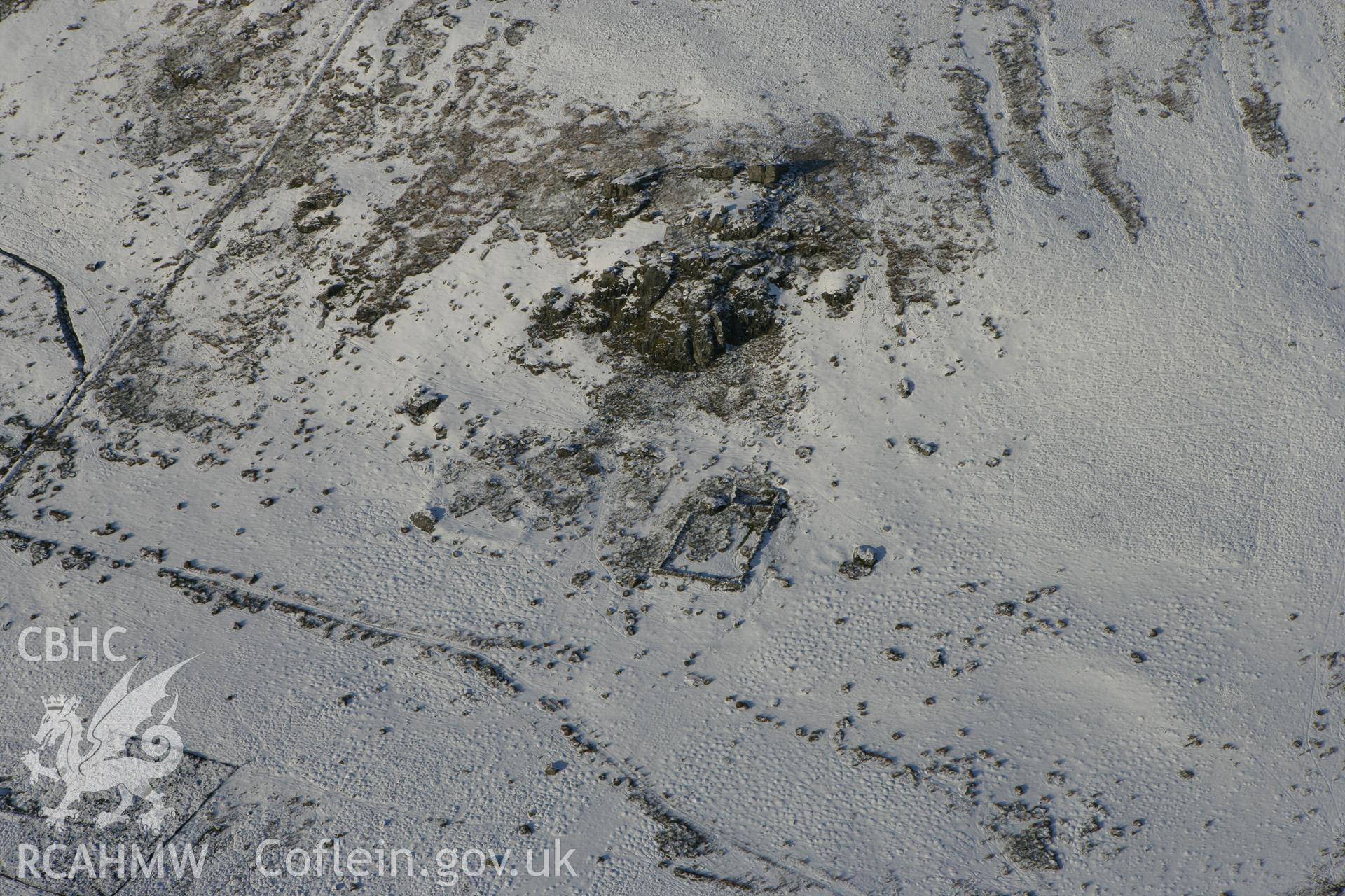 RCAHMW colour oblique photograph of Carn Afr, sheepfold and settlement earthworks. Taken by Toby Driver on 01/12/2010.