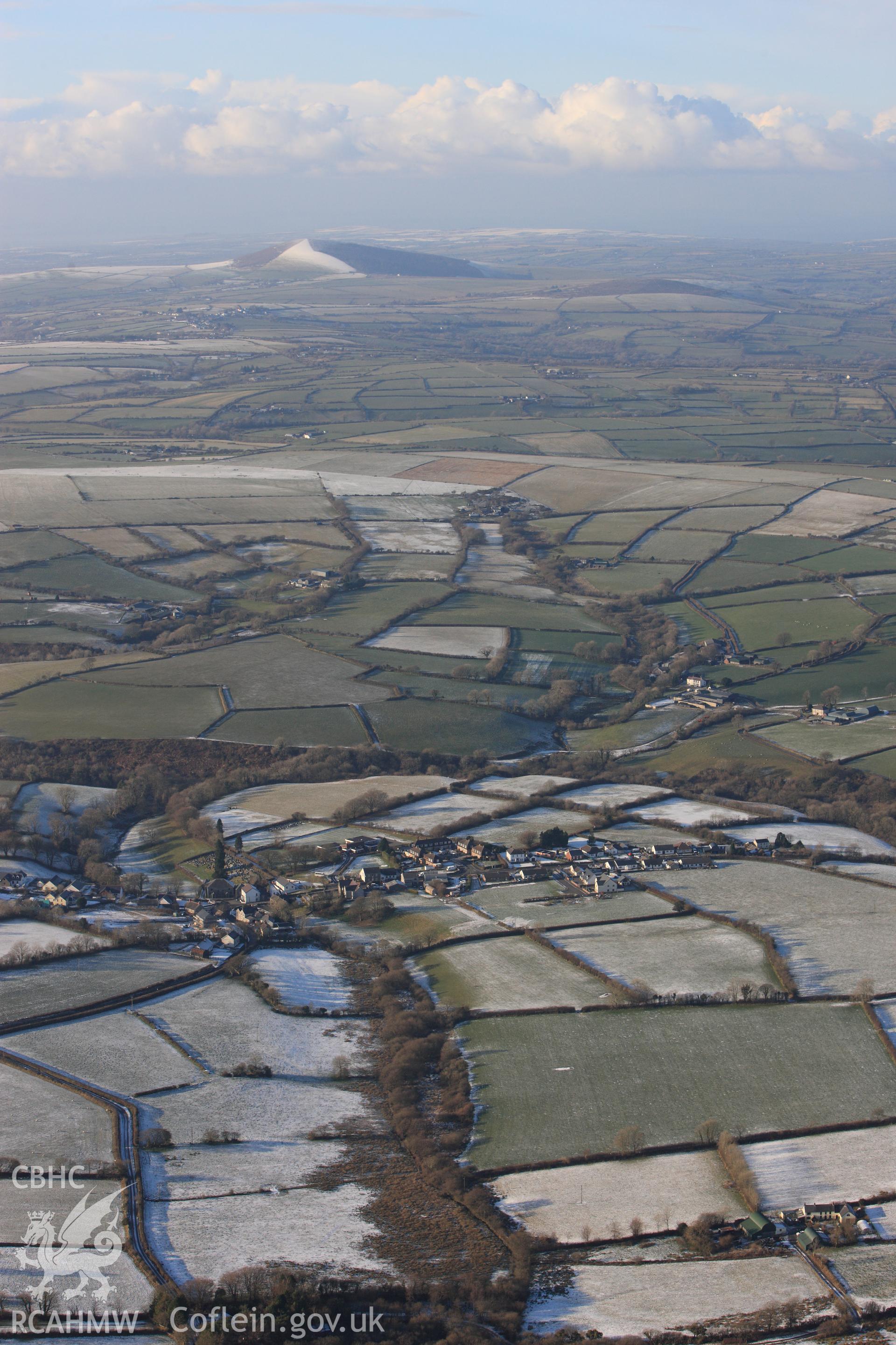 RCAHMW colour oblique photograph of Trelech village, looking north-west to Frenni Fawr. Taken by Toby Driver on 01/12/2010.
