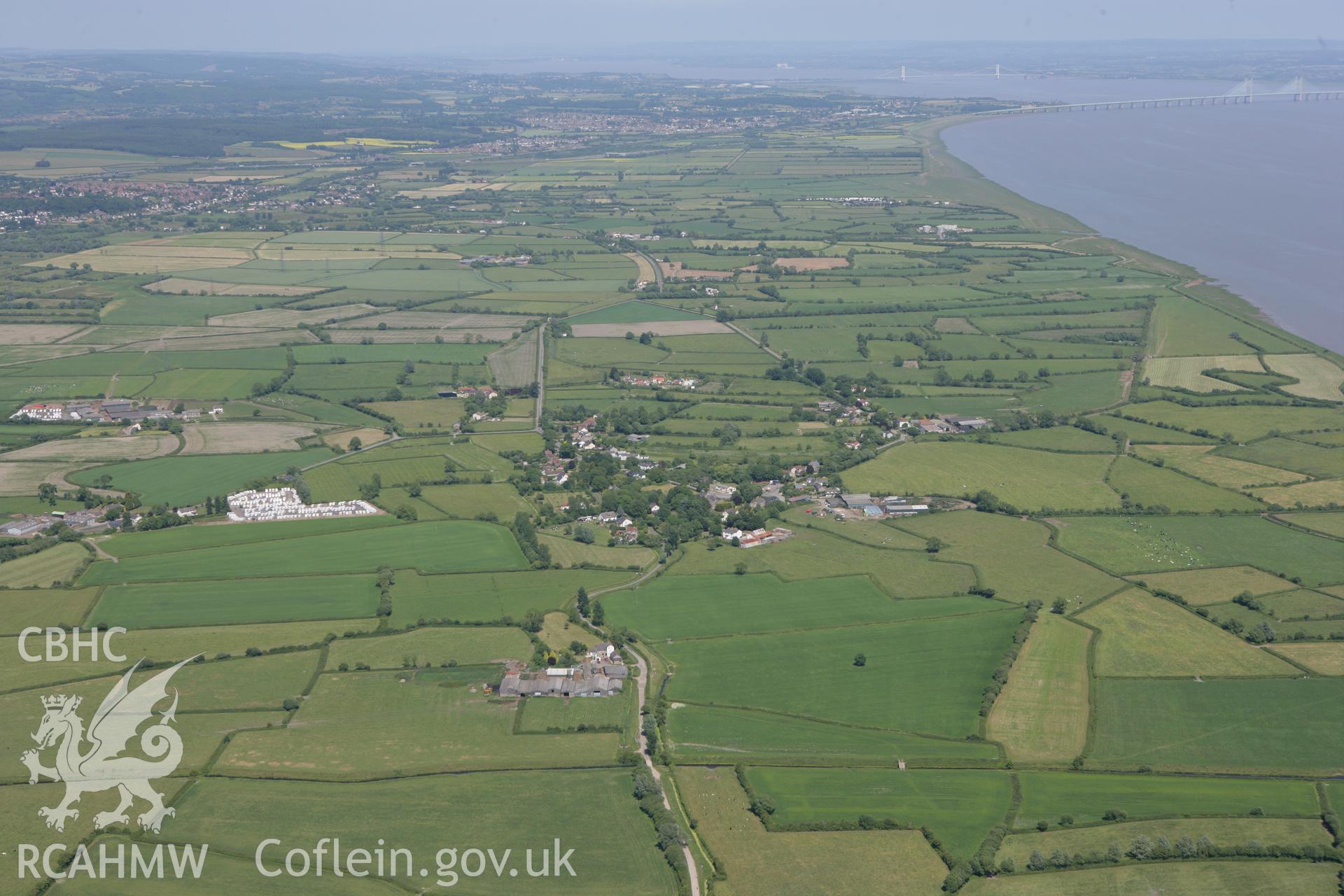 RCAHMW colour oblique photograph of landscape looking west over Redwick and Magor towards the Second Severn Bridge Crossing. Taken by Toby Driver on 21/06/2010.