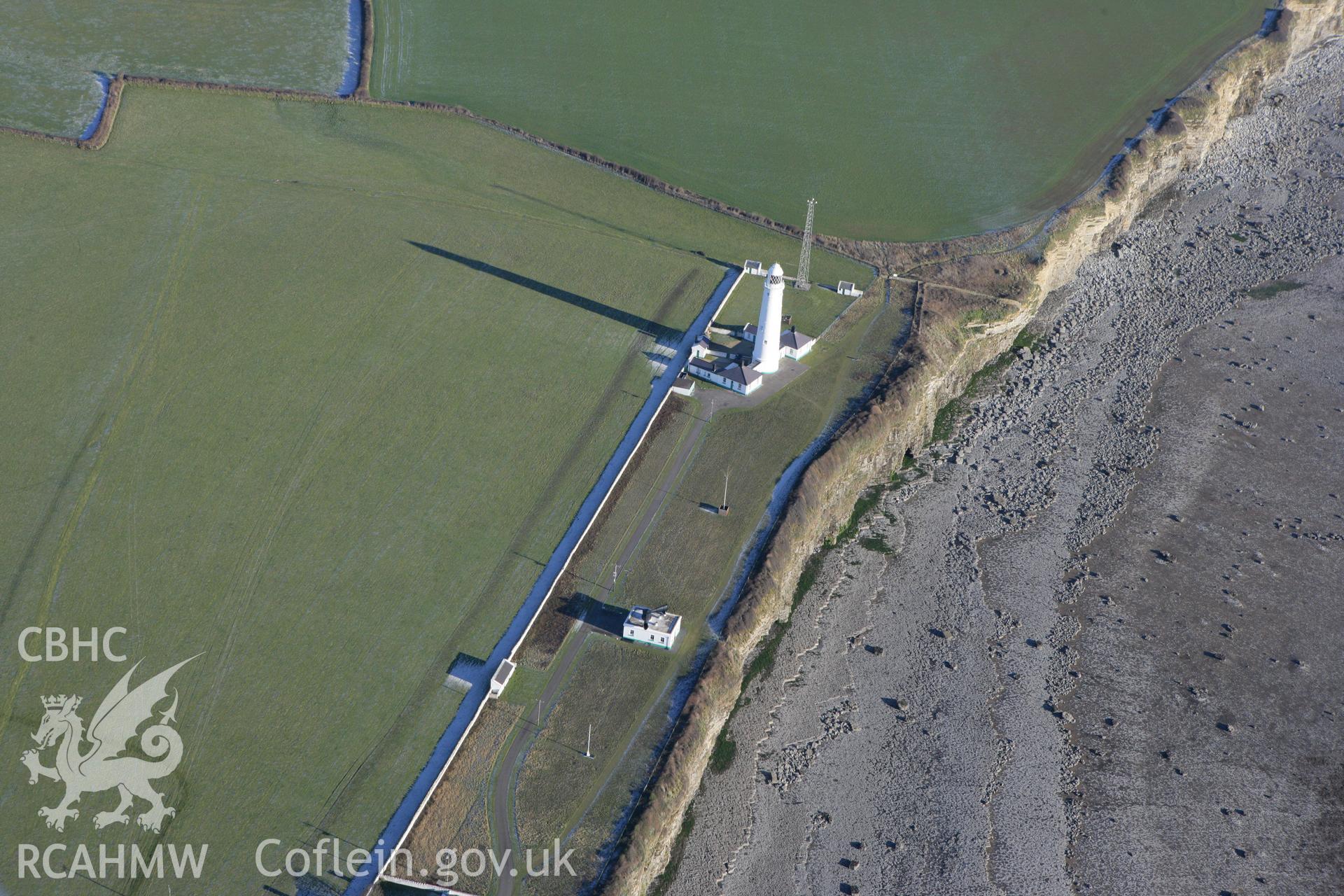 RCAHMW colour oblique photograph of Nash point lighthouse, showing east tower and the foghorn signal building. Taken by Toby Driver on 08/12/2010.
