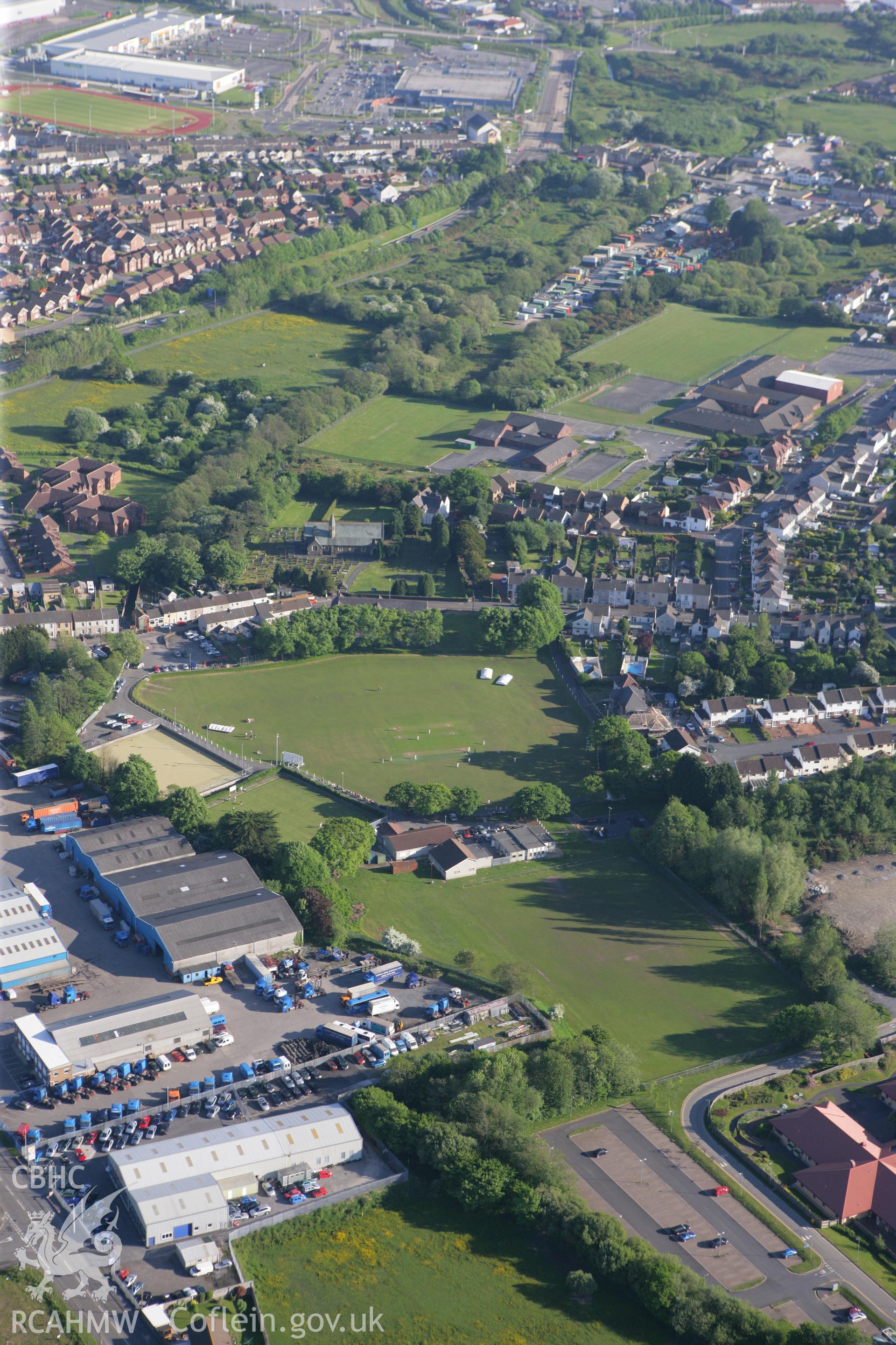 RCAHMW colour oblique photograph of St. Mary's Catholic Primary School and St. John Lloyd Catholic Comprehensive School. Taken by Toby Driver on 24/05/2010.