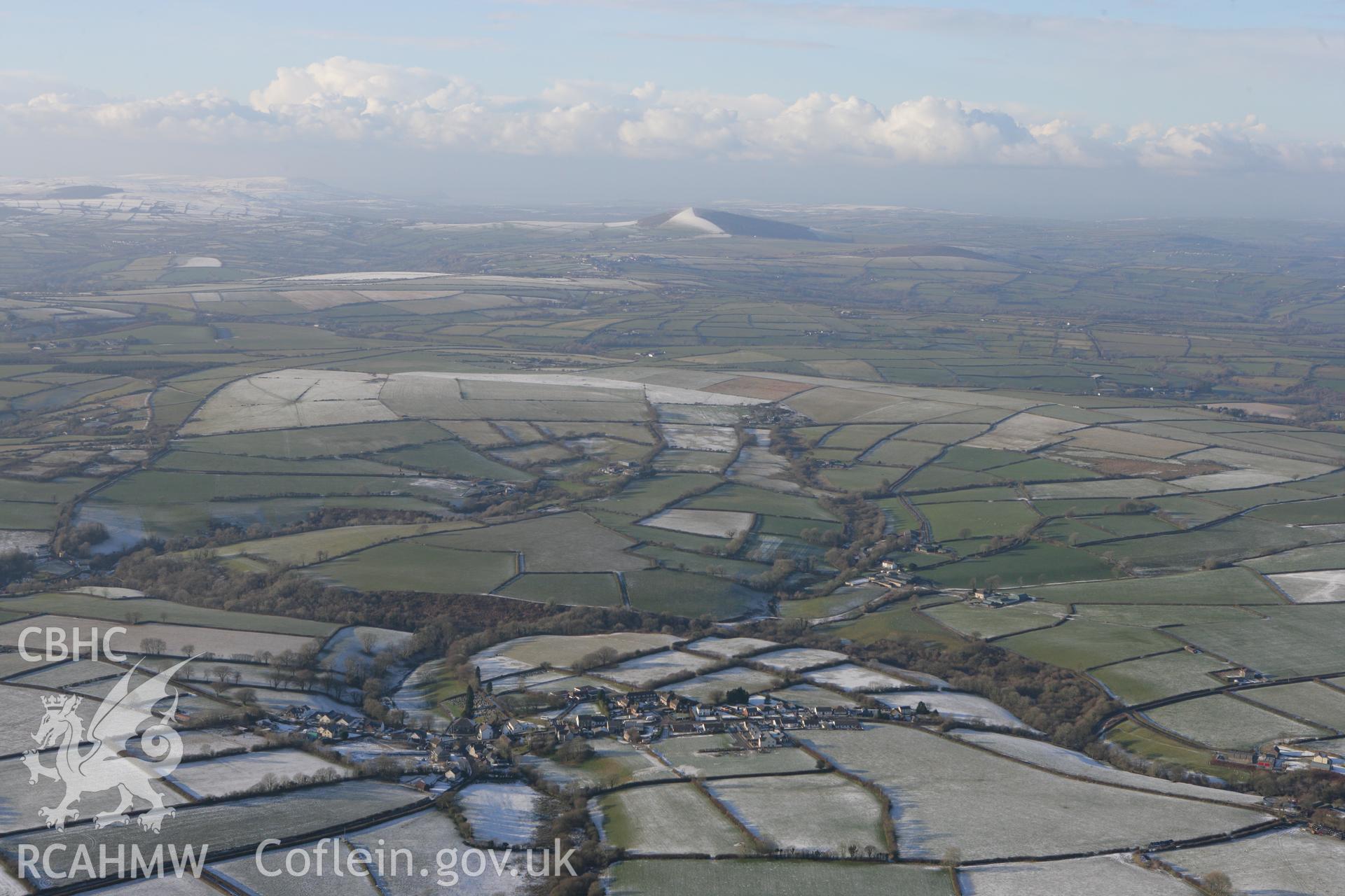 RCAHMW colour oblique photograph of Trelech village, looking north-west to Frenni Fawr. Taken by Toby Driver on 01/12/2010.
