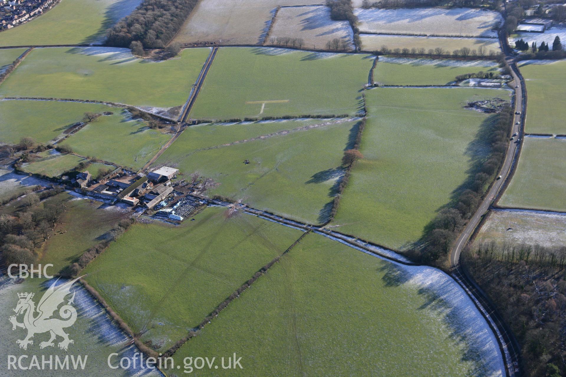 RCAHMW colour oblique photograph of Pentrebane, with possible undated earthworks to the south-west. Taken by Toby Driver on 08/12/2010.