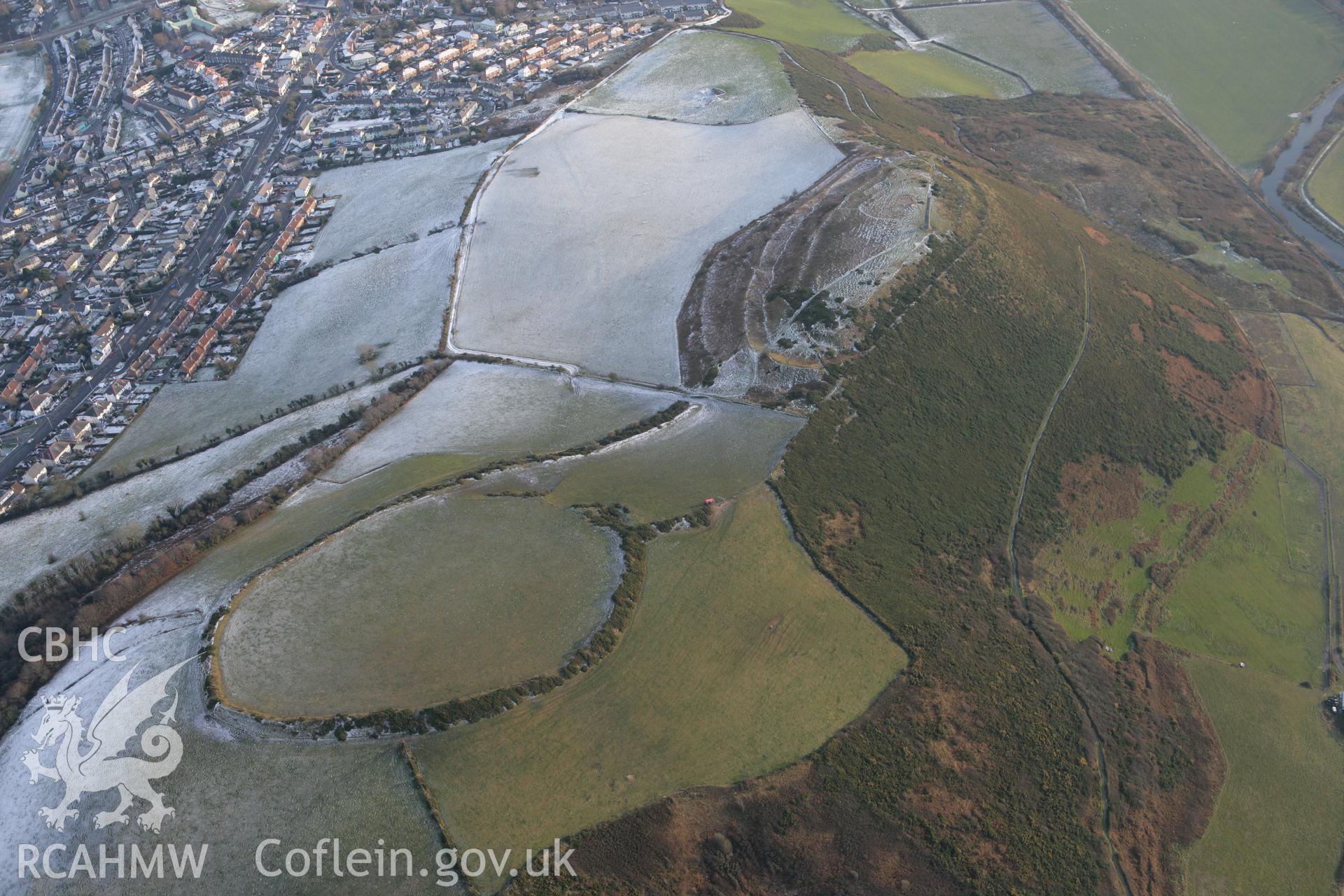 RCAHMW colour oblique photograph of Pen Dinas hillfort, with snow. Taken by Toby Driver on 02/12/2010.