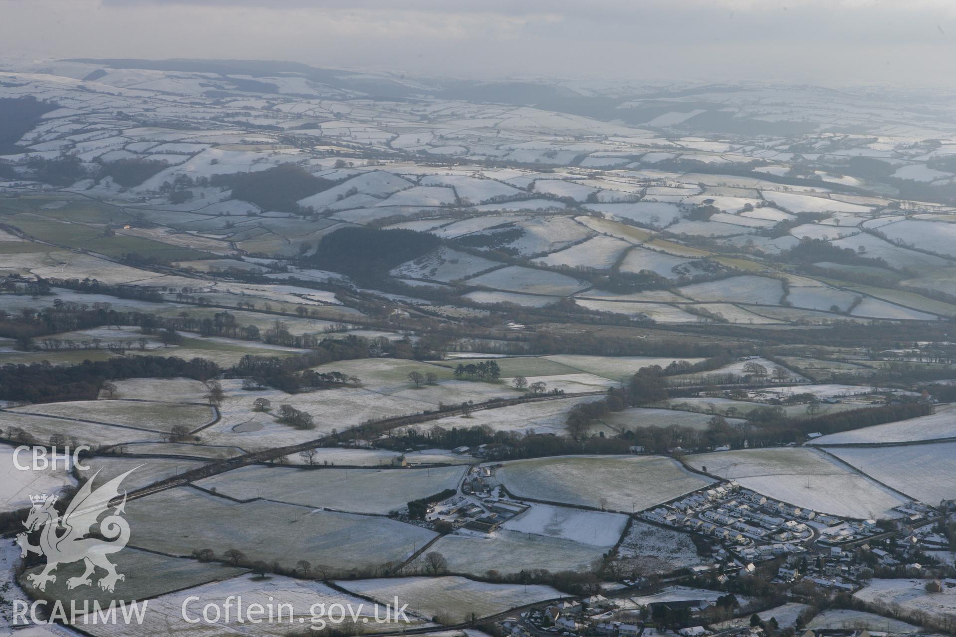 RCAHMW colour oblique photograph of Comins Coch looking south-east. Taken by Toby Driver on 02/12/2010.