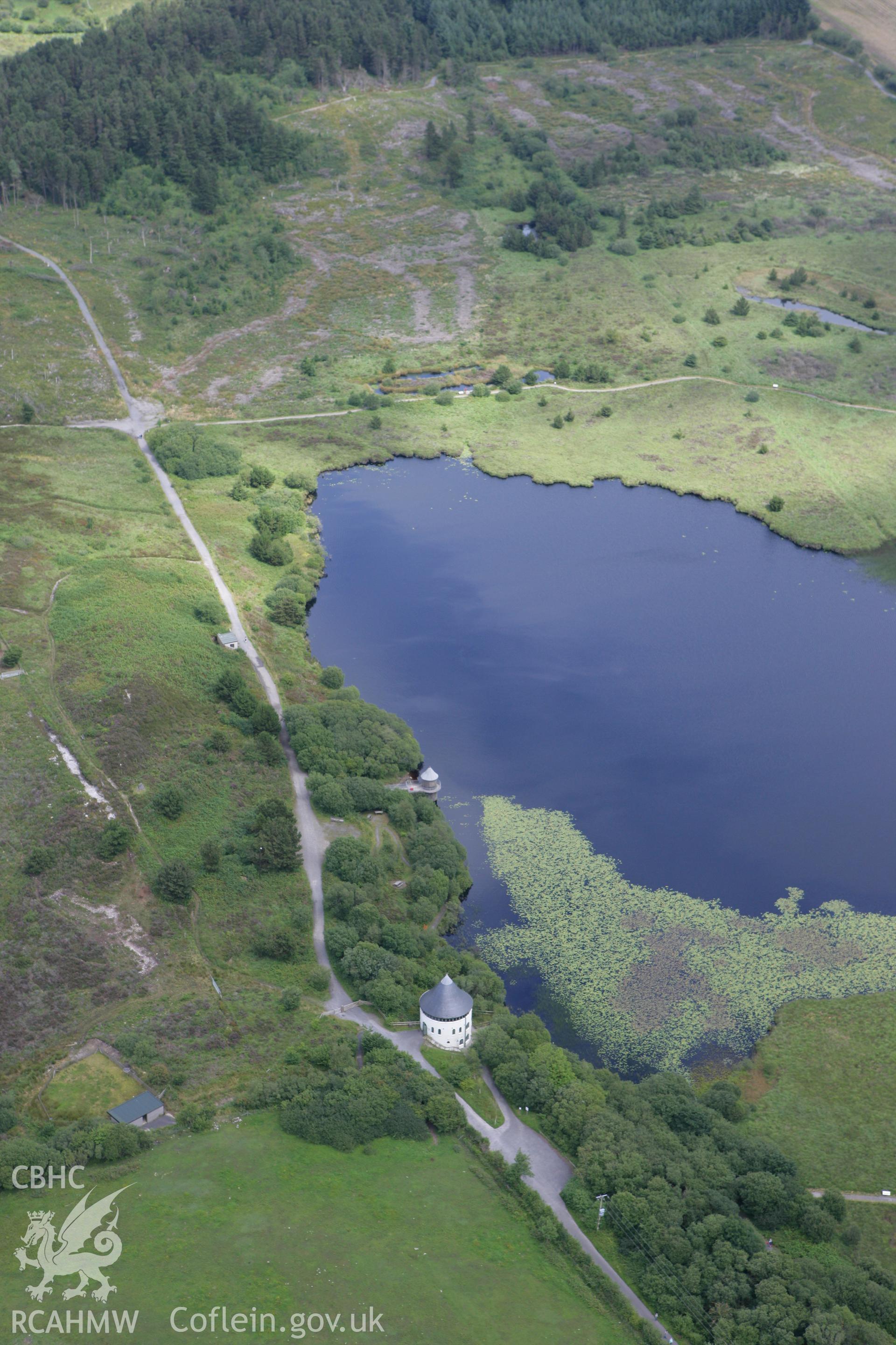 RCAHMW colour oblique photograph of Llyn Llech Owain and visitors centre. Taken by Toby Driver on 29/07/2010.