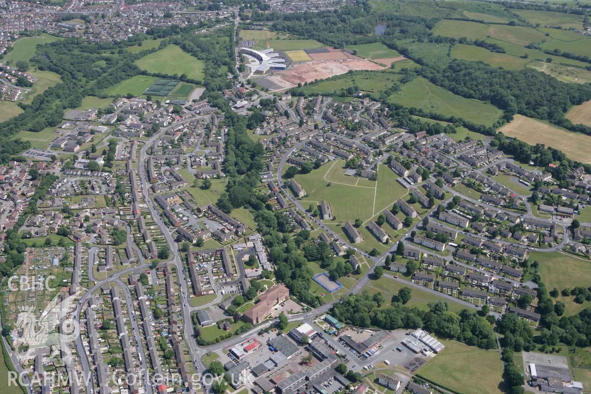 RCAHMW colour oblique photograph of Bettws, Newport, showing Newport High School in the distance. Taken by Toby Driver on 21/06/2010.