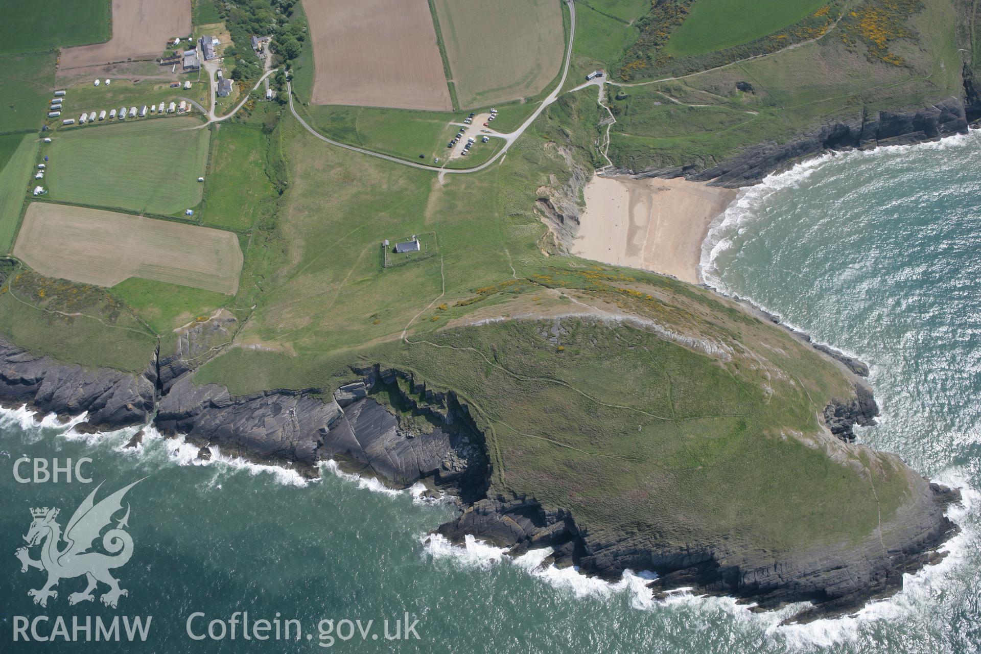 RCAHMW colour oblique photograph of Mwnt, promontory fort and church. Taken by Toby Driver on 25/05/2010.