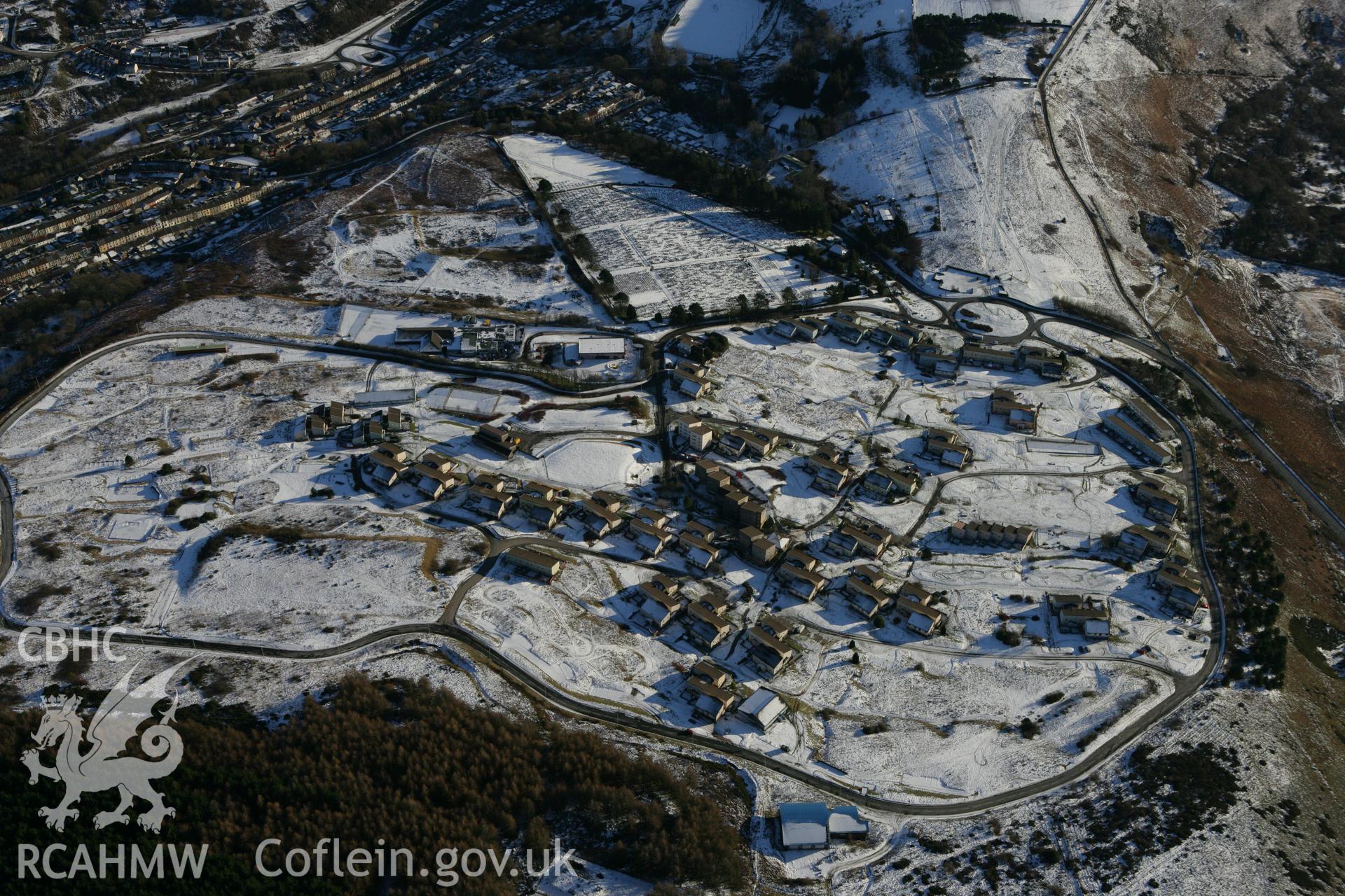 RCAHMW colour oblique photograph of Penrhys village with Penrhys Primary School. Taken by Toby Driver on 08/12/2010.