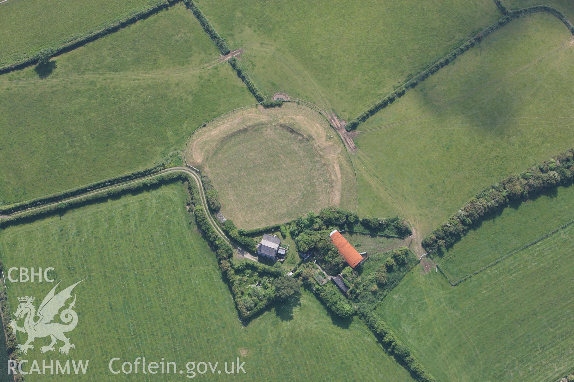 RCAHMW colour oblique photograph of Castell Bryn Gwyn, Neolithic henge and later ringwork. Taken by Toby Driver on 10/06/2010.