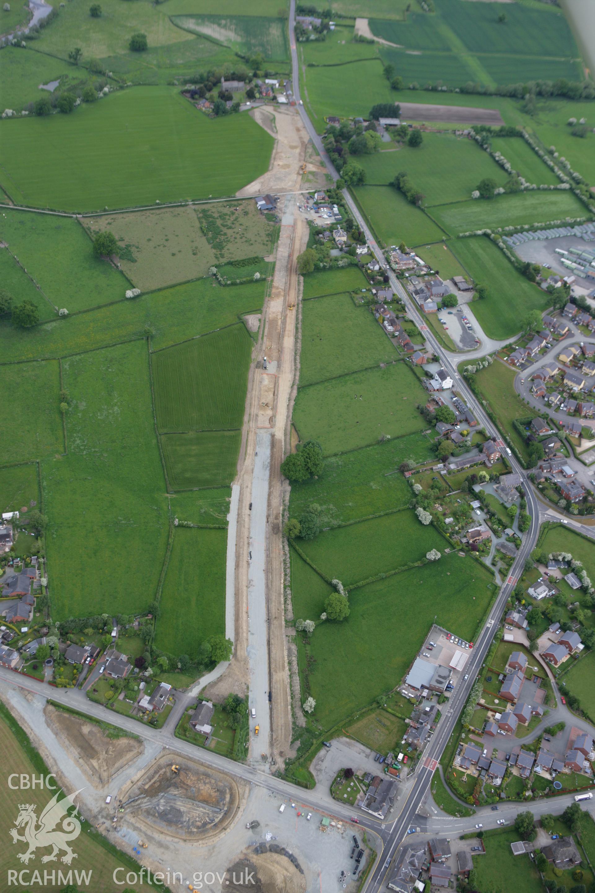 RCAHMW colour oblique photograph of Four Crosses Bypass, under construction. Taken by Toby Driver on 27/05/2010.
