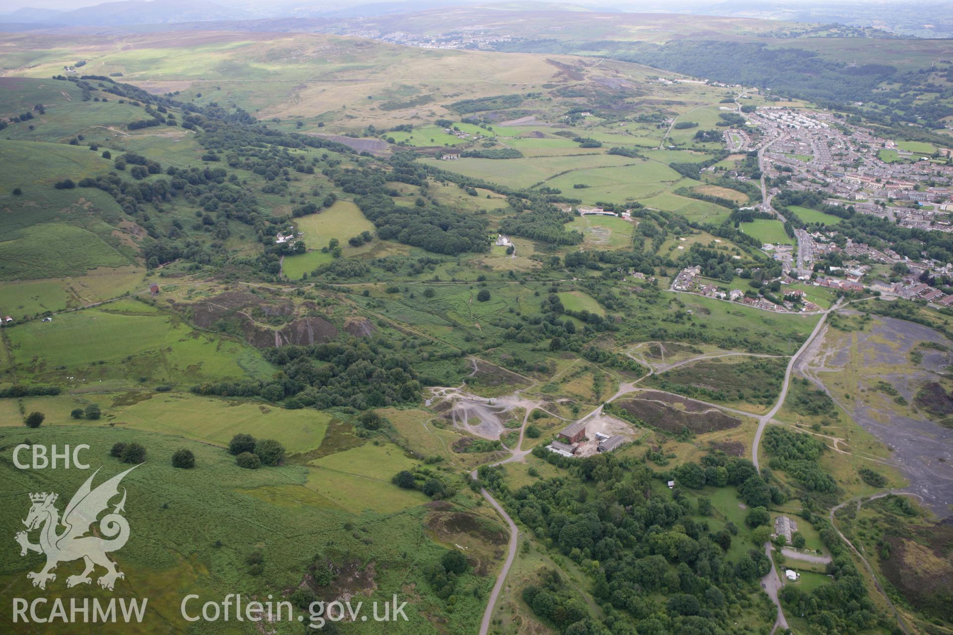 RCAHMW colour oblique photograph of Cwmsychan Red Ash Colliery, from the south-west, with Abersychan in the distance,. Taken by Toby Driver on 29/07/2010.