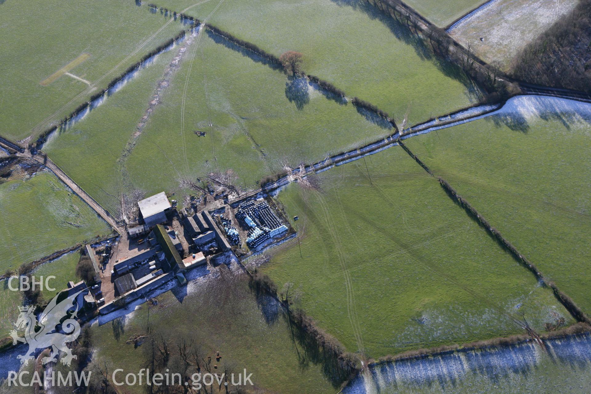 RCAHMW colour oblique photograph of Pentrebane, with possible undated earthworks to the south-west. Taken by Toby Driver on 08/12/2010.